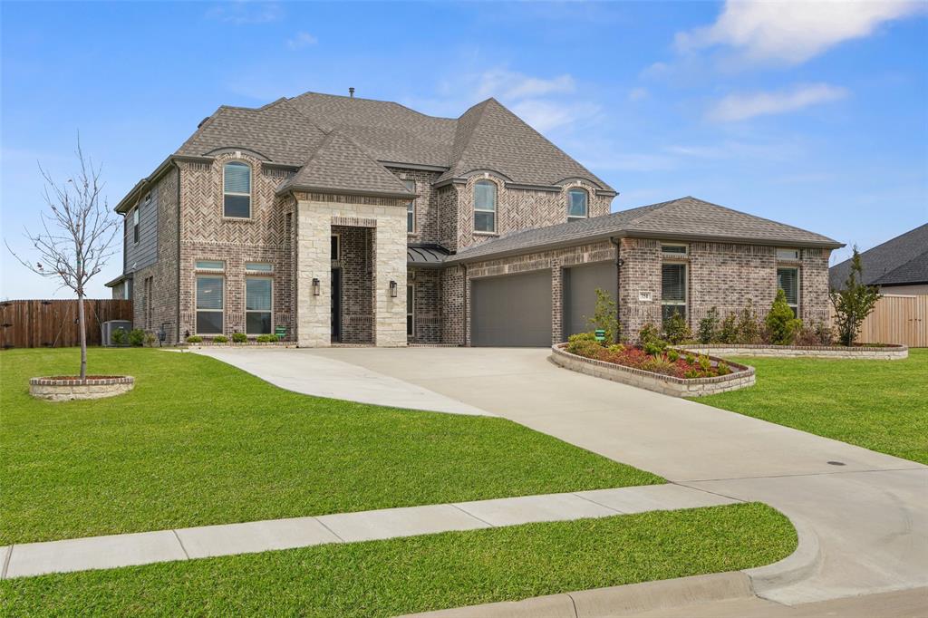 BEAUTIFULLY UPGRADED AT BROADMOOR ESTATES!  This gently lived in 6 bed, 4 bath, 2-story home on the outer perimeter does not currently have a backyard neighbor and is move-in ready with a long list of upgrades.  Built in 2024, this seller chose to enhance the standard plan with an extended driveway and extra fencing along with wider porches on both the front and back exteriors.  Security cameras were added and the media room was equipped with a 110 inch projector that will stay with the home.  Surround sound throughout the entire home is another perk of this stunning home.  A third car garage addition added extra space along with enhanced epoxy garage floors.  Upgraded carpet and engineered hardwood flooring selections were chosen along with quartz kitchen counters and stainless, gas appliances. Rain gutters, sprinkler system and enhanced brick planter beds were also added to the original home. Formal dining space, breakfast nook and additional kitchen island eating offer a variety of dining choices.  Both a butler's pantry and a walk-in pantry serve as a transition between the gorgeous kitchen and the formal dining area.  Trayed ceiling in primary bedroom, vaulted ceilings in family room, and a show-stopping curved, metal staircase all contribute heavily to the constant wow factors you will encounter.  Multiple walk-in closets, great storage, and a separate office area with double glass doors make this the perfect home for a growing family.  Red Oak ISD. Broadmoor Est has a mandatory HOA managed by Singer Mgmt and is $1,100 per yr. Assumable VA loan per seller!