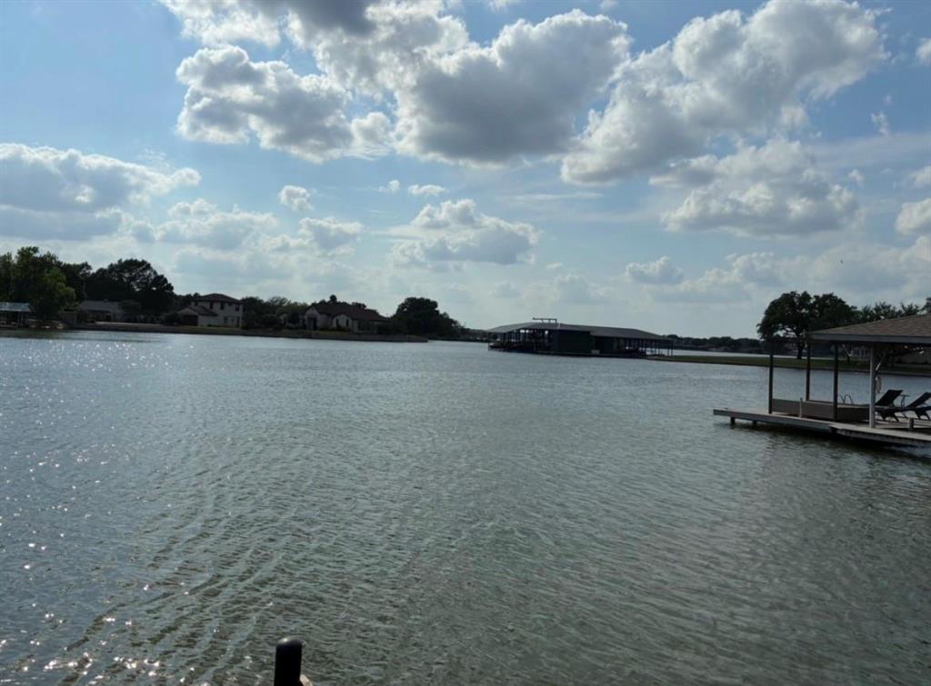 Price Adjusted. Motivated Seller. This is a RARE find. WATERFRONT PROPERTY on the coveted private road of Island Village Estates. This property has it ALL, including a dock with 12-foot water and irrigation system. Bedrooms are large and spacious. Large open dining area. Two HVAC systems. There is a 3-car garage, including a 220-volt outlet, plus the RV garage, plus storage, plus a heated and cooled Workshop...ALL under one roof. 533 square foot Workshop can be converted into a mother-in-law suite, or short-term rental with private entrance. It has a work sink and a separate toilet. HUGE Covered patio with epoxy flooring, large-fenced backyard that goes to the water, with many oak and pecan trees. Beautiful sunset view. New roof installed in 2025. When you do the math, that is a total of 2,935 square feet, that is both heated and cooled space. No HOA. Come and see!