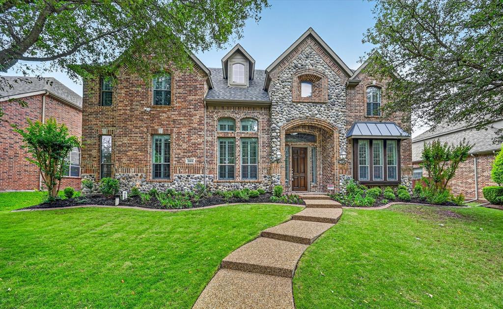 Experience the ultimate lifestyle in this custom built and beautifully updated Plano estate, where a private backyard oasis featuring a PebbleTec pool, spa, and cascading waterfall creates an immediate sense of tranquility. Sophisticated hand-scraped wood flooring and fresh paint guide you into a grand family room, where soaring ceilings showcase an impressive floor-to-ceiling stone fireplace. The chef in your family will love the gourmet kitchen boasting granite countertops, a large island, and a breakfast bar that flows seamlessly into the living area for effortless entertaining. This culinary space is fully equipped with all new stainless steel appliances including cooktop, vent hood, dishwasher, smart double ovens, and microwave, a butler’s pantry, and a built-in planning center. Tucked away for maximum privacy, the primary suite offers a bay window sitting area, double tray ceilings, and direct pool access, complemented by an ensuite with a jetted tub, separate shower, separate vanities with a makeup area, and a massive walk-in closet. Upstairs, multiple staircases lead to a versatile floor plan featuring oversized secondary bedrooms with walk-in closets and a large game room graced with a snack bar and a built-in desk. Movie nights are elevated in the massive media room, which comes complete with a screen, dimmable lighting, and pre-wiring for a projector. A dedicated home office with French doors and a wall of built-ins provides a quiet workspace, while a massive storage room ensures a place for everything accessible off the media room. Practical luxury continues with a three-car garage featuring an EV charging station. Relax on the covered patio overlooking your backyard paradise, or explore the scenic trails of nearby Capstone Park. Perfectly situated within the highly sought-after Plano ISD, this residence combines premium amenities with an unbeatable location.