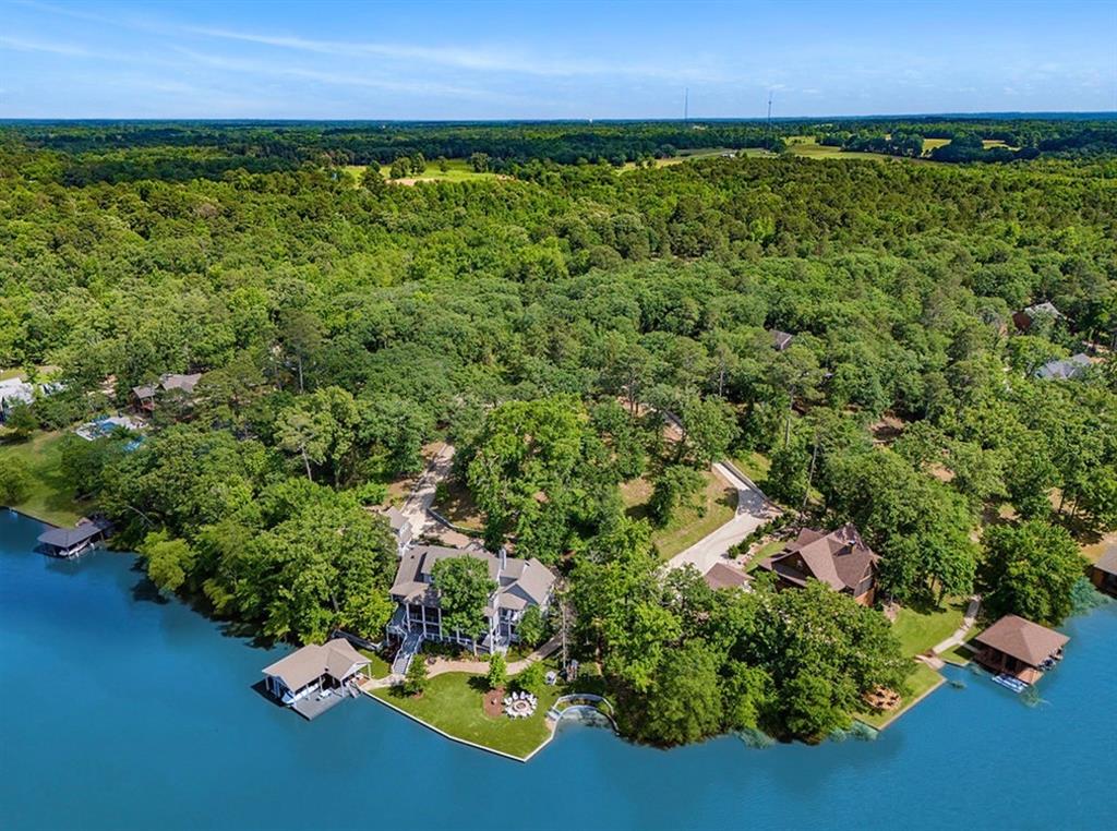 Rare opportunity to own a prime waterfront lot in the highly sought-after Lands End Addition on beautiful Lake Cypress Springs. This 1.06-acre wooded lot boasts 125 feet of pristine water frontage and extends approximately 350 feet deep, offering both privacy and stunning lake views featuring deep water. A storage building is already on-site for your convenience. Located in a gated community with HOA, the property is subject to building restrictions to maintain the neighborhood’s charm and value. Enjoy the peace of mind that comes with a well-maintained and secure environment. Lake Cypress Springs, nestled in Franklin County northwest of Pittsburg, spans 3,461 acres with a maximum depth of 56 feet. It’s a premier destination for boating, skiing, and fishing, well-known for its largemouth and spotted bass, catfish, crappie, and sunfish. Whether you’re planning to build a dream lake house or secure a serene getaway, this lot offers the perfect combination of natural beauty, recreation, and community.