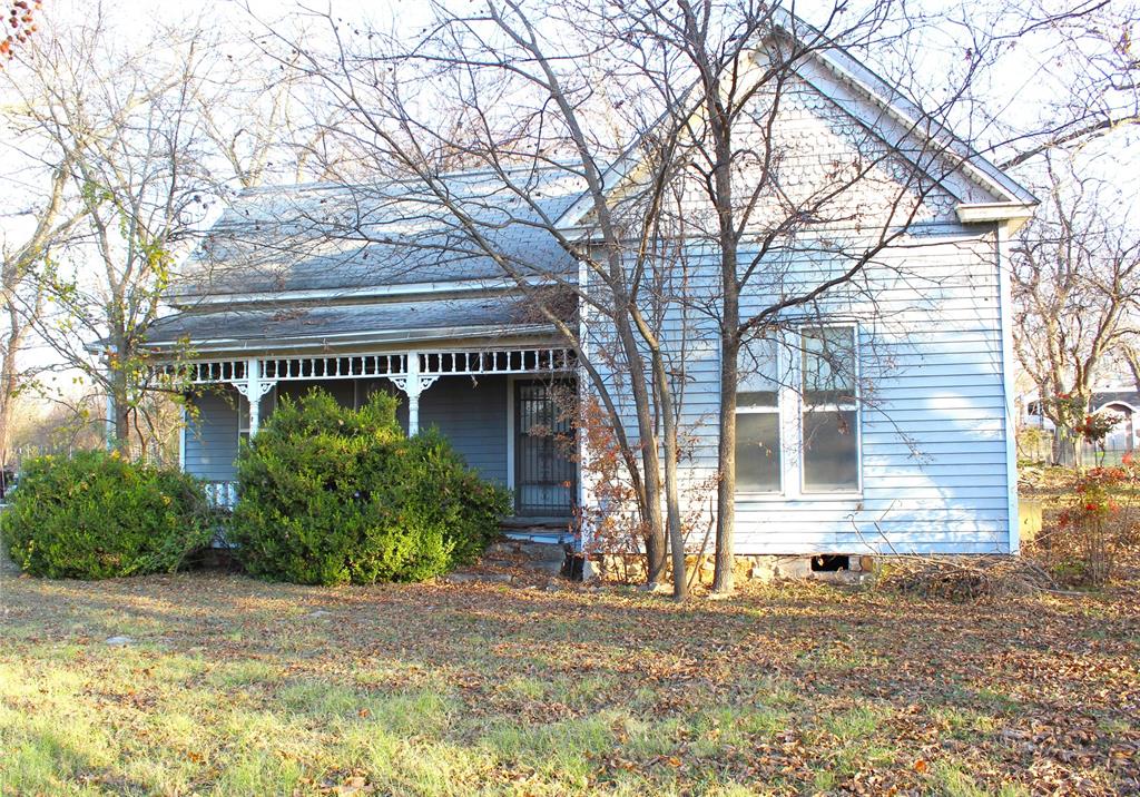 HANDY MAN DELUXE! Here is a house that needs to be totally renovated. The outside has a lot of character but remodeled it could be cute! The house is a 2 bedroom 1 bath and it is on a large treed lot with a lot of yard space.