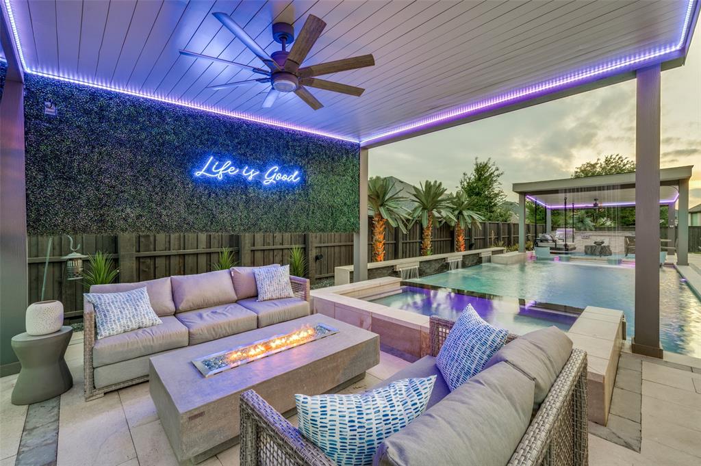 Some homes are built. Others are transformed into something the market rarely sees.

This north-facing Star Trail residence has been elevated by over $400,000 in custom upgrades — every detail considered, nothing left to chance. Four bedrooms, 4.5 baths, and more than 4,700 square feet crafted for the way a family actually wants to live.

The heart of the home is a chef's kitchen that earns the title — anchored by a stunning waterfall-edge island, premium appliances, and a custom LED-lit bar just around the corner, complete with open display shelving and full cabinetry. It is the kind of space that makes entertaining feel effortless and staying home feel like a privilege.

Glass sliders open to a backyard that stops you in your tracks. A resort-style pool and spa, fire pit, covered living and dining areas, and a fully equipped outdoor kitchen create a private sanctuary built for everything from quiet family evenings to unforgettable gatherings under the Texas sky.

The primary suite is privately nestled on the main level, offering the seclusion a discerning buyer deserves, alongside a dedicated home office. Upstairs, the second floor becomes its own destination — a custom oversized media room with professional acoustics, high-end AV, and color-changing lighting, paired with a stylish game room featuring a built-in wall unit.

Custom trim work, tailored built-ins, designer wallcoverings, and curated lighting carry throughout. Closets by Design in every suite. A finished four-car garage with epoxy floors and EV charging.

Star Trail. Prosper ISD. Turnkey.

This is not just a home — it's the one.