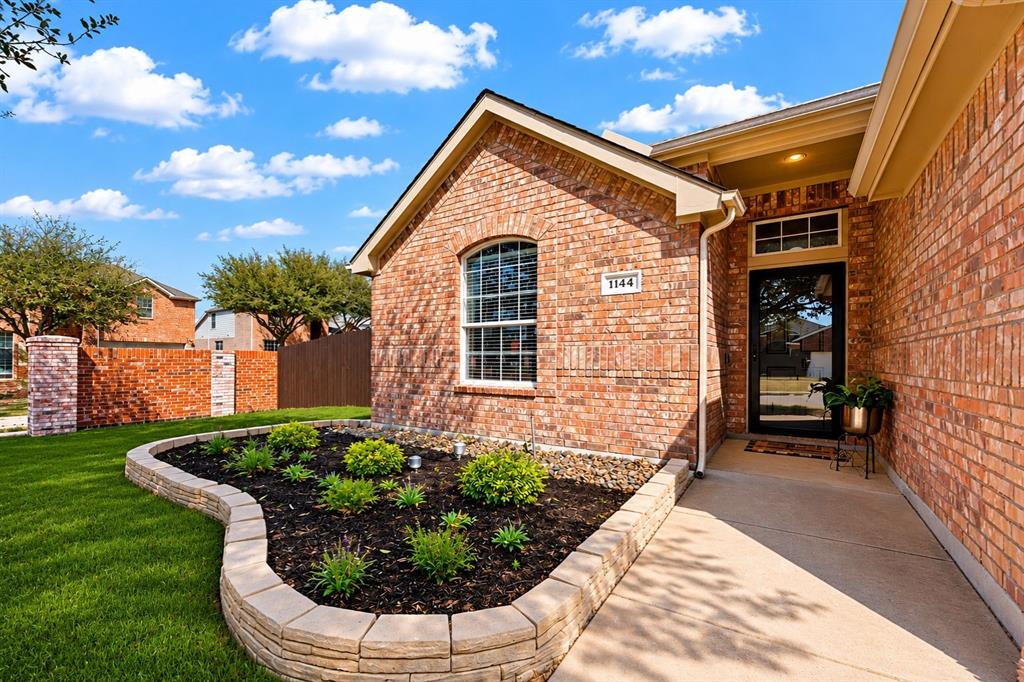 Situated on a beautifully maintained corner lot in Burleson, TX, 1144 Hearthstone Drive offers a blend of comfort, thoughtful upgrades, and modern style. From the inviting curb appeal to the established landscaping, this home makes a lasting first impression. Inside, a light-filled open layout offers the perfect balance of everyday comfort and easy entertaining. 
The spacious living area flows seamlessly into the kitchen and dining spaces, while stylish accent walls add warmth and character throughout. 
The kitchen features newer appliances purchased in 2024, abundant cabinetry, generous counter space, and a functional layout ideal for gatherings and daily living.
Additional highlights include built-in shelving in the garage for extra storage, a portable generator plug for added convenience, and a radiant barrier in the attic to help improve energy efficiency year-round.
Step outside to a backyard ready for relaxing or entertaining. The playground and outbuilding will convey with the property, adding even more value and versatility. The outbuilding does have electricity!
Conveniently located near shopping, dining, schools, and commuter routes, this move-in ready Burleson home blends style, functionality, and smart updates in one inviting package. Within walking distance of Fraizer Elementary school and Claudias Playground!