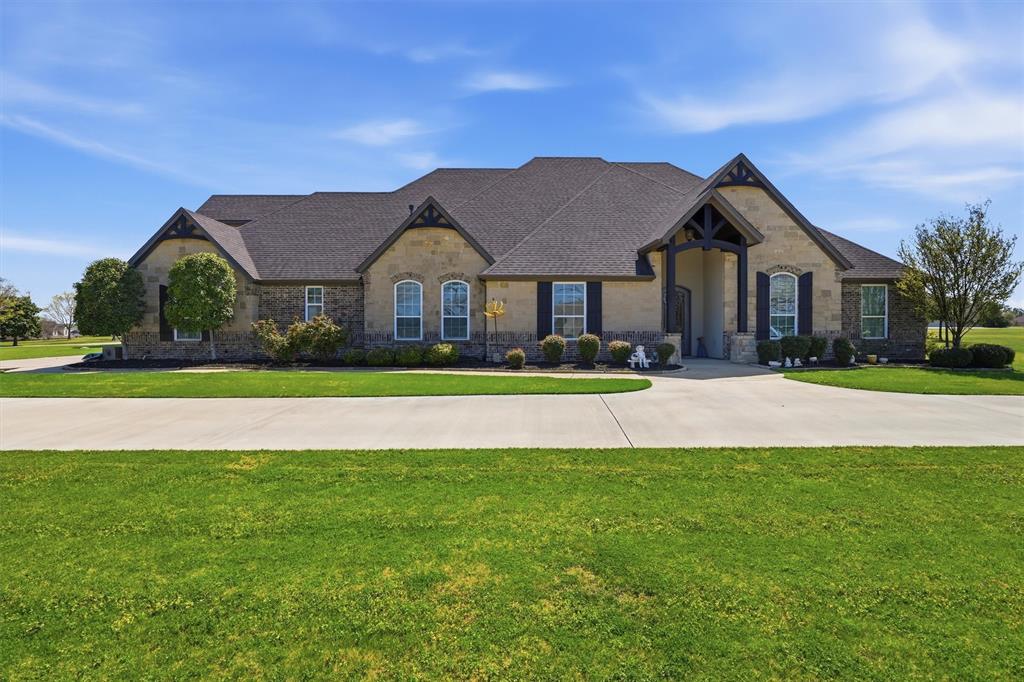 Welcome to Luxury Living in The Peninsula where Elegance, Comfort, and Thoughtful Design come together on nearly two Beautifully Maintained Acres inside a Private Gated Community near Lake Granbury. This stunning home immediately captivates with soaring ceilings and an abundance of natural light that fills every space, creating a bright and inviting atmosphere. Designed with both everyday living and entertaining in mind, the heart of the home is a true dream kitchen featuring high-end finishes, a kitchenette providing extra counter space, and custom cabinetry throughout allowing ample space for gathering with family and friends. A Beautiful Custom-Built Addition completed in 2020 features its own private entrance, an office or craft room space with custom working areas, built-in craft cabinets, custom built-in dog crates, and a secondary primary bedroom and bath featuring two private bathroom and vanity spaces. The thoughtfully designed floor plan offers flexibility and privacy perfect for multi-generational living or hosting guests in style. Step outside to experience seamless indoor and outdoor living where gorgeous window doors open wide to the outdoor patio off the enclosed outdoor living area, complete with a cozy fireplace and inviting space perfect for year-round enjoyment. A custom designed outdoor kitchen overlooks the peaceful backyard, creating the ultimate setting for entertaining under the Texas Sky. With its prime location near Lake Granbury, expansive acreage, and gorgeous custom features throughout, this exceptional property offers the perfect blend of privacy, sophistication, and luxury. Schedule your private showing Today and experience it for yourself.