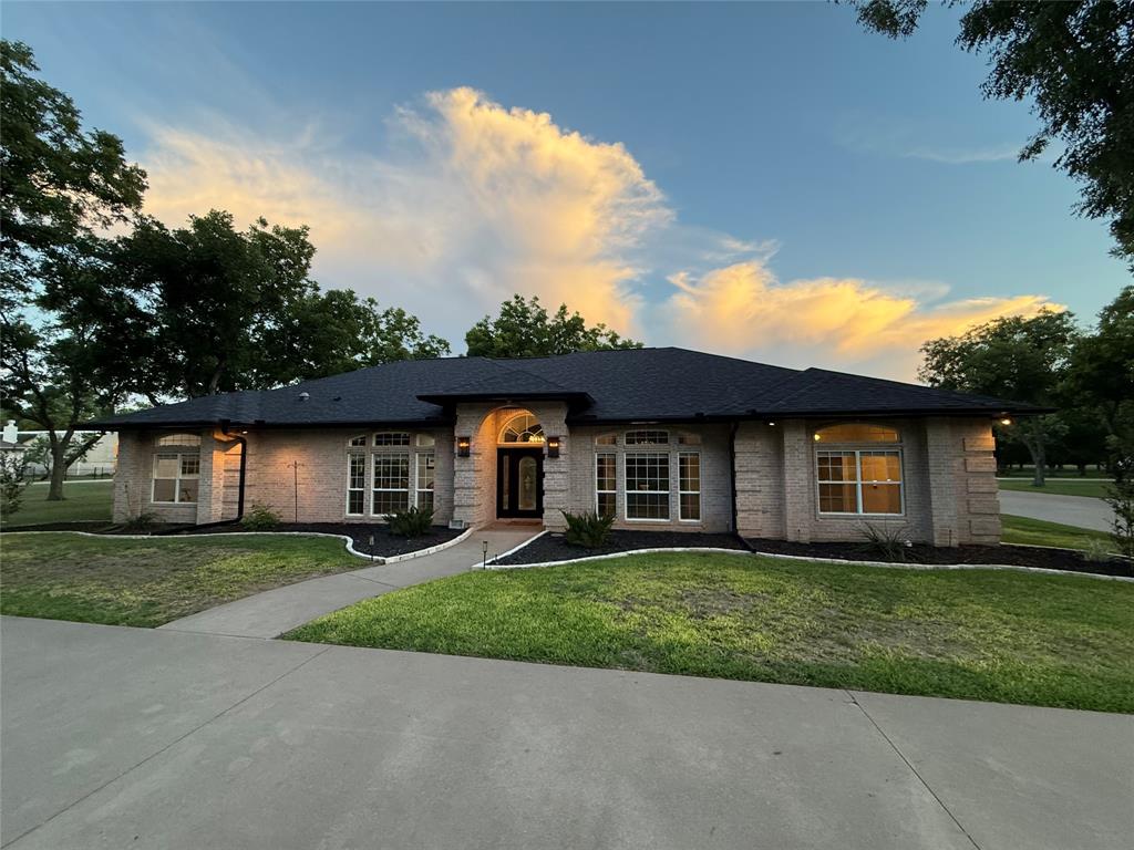 ALMOST 100K PRICE IMPROVEMENT!!! Located in the original section of Pecan Plantation Airpark (FAA identifier 0TX1), this well-designed single-story home offers 2,992 sq ft with 3 bedrooms, 3 baths, 2 living areas, 2 dining areas, and a versatile bonus room that could serve as a 4th bedroom. Built in 2002 on 1.46 landscaped acres with several mature pecan trees, the functional floorplan provides generous living and entertaining space, complemented by a large screened patio. Energy-efficient geothermal HVAC adds long-term value. Concrete taxiway access and close proximity to the runway enhance convenience. The impressive 4,000 sq ft hangar features a 68x14 Higher Power door, 18x14 overhead door, and a 28x15 climate-controlled workshop office. Enjoy all the amenities of Pecan Plantation, including 17 miles of Brazos River with three private beaches, a private marina with access to Lake Granbury, golf, clubhouse dining, pools, tennis, parks, shopping, and on-site medical facilities—offering a true fly-in lifestyle within a full-service gated community.
