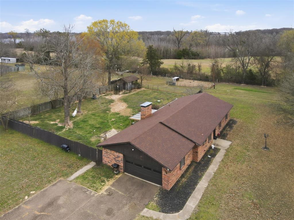Welcome to peaceful country living just minutes from town! This well maintained 3 bedroom, 2 bath brick home sits on a beautiful 1.25 acre corner lot, offering space, privacy and plenty of room to enjoy the outdoors. Inside you'll find spacious living area with great natural light, creating warm and inviting place to gather with family and friends. The functional layout flows comfortably into the dining and kitchen areas, making everyday living and entertaining easy. Open yard with mature trees and wide-open space, perfect for relaxing evenings, gardening or simply the quiet surroundings. The corner lot provides added privacy and flexibility for outdoor use. If you've been searching for a property that offers the charm of country living with the convenience of nearby amenities, this home is one you won't want to miss.