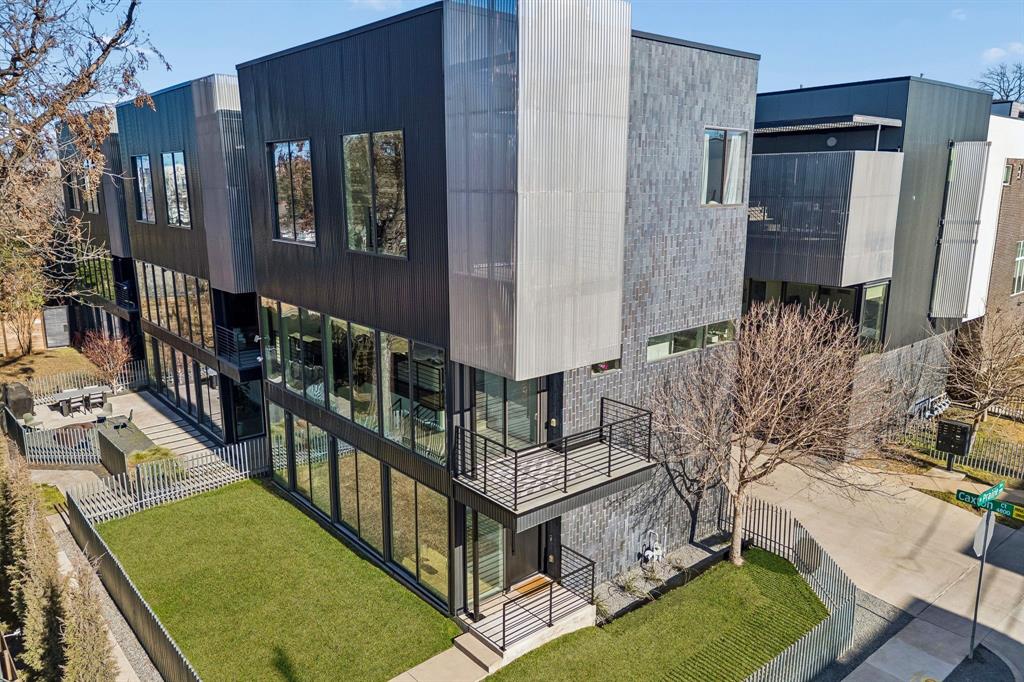 Designed by AIA award-winning architect Josh Nimmo, this architecturally significant, fully detached corner residence at Caxton Court is a three-level modern standout—with no HOA. Thoughtfully designed to maximize natural light and privacy, the home features striking vertical brick detailing, an open yet functional floor plan, and expansive floor-to-ceiling windows throughout. Clean-lined modern finishes include 10-foot ceilings, floating steel staircases, concrete and white oak hardwood floors with a rich coffee stain, and sleek quartz surfaces. The waterfall-edge kitchen is both beautiful and functional, outfitted with Bosch stainless appliances and ample storage. All three bedrooms feature en-suite white quartz baths, creating a true private-suite experience. Additional highlights include a fenced outdoor yard, a high-ceiling two-car attached garage, and custom window shades throughout. This is a rare opportunity to own a modern, architect-driven single family home in one of Dallas’ most desirable in-town locations.