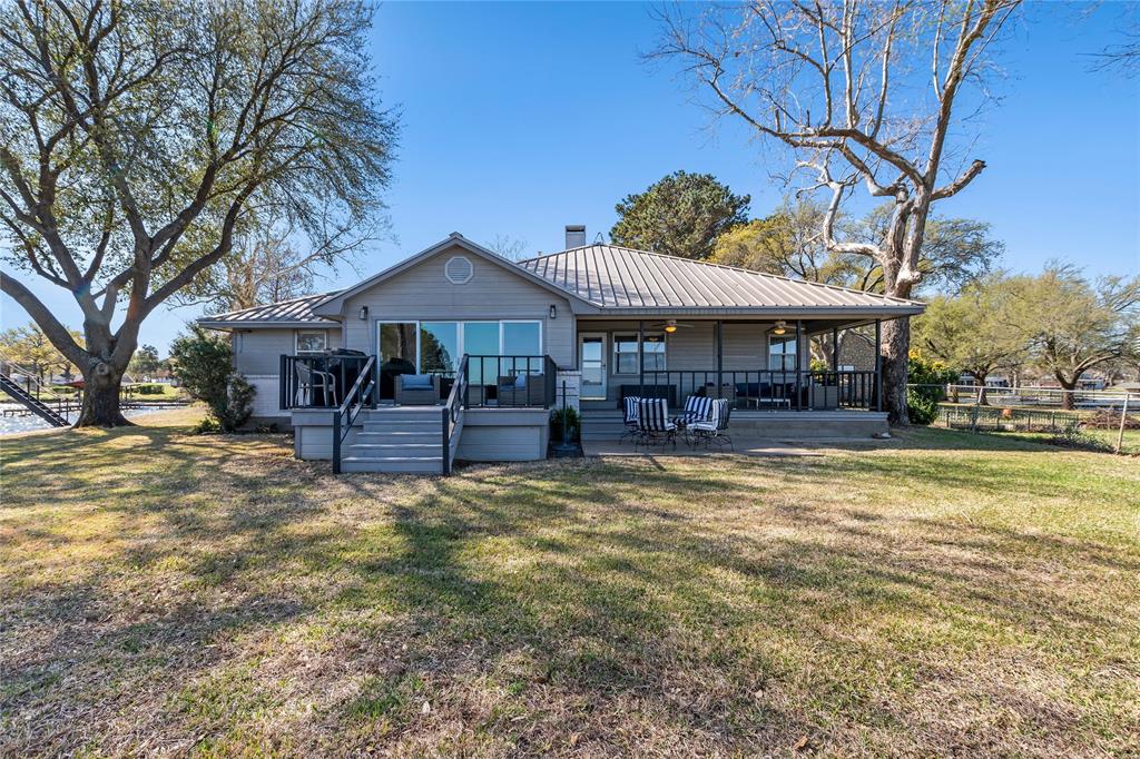 One of a kind Lake House that was completely remodeled in 2023. The house sits on a point with over 253 feet of waterfront overlooking one of the most beautiful wide coves on Cedar Creek Lake.  Good deep water with wide open water views. The large open floor plan overlooks the big backyard and lake.  Plenty of parking and garage storage as well with a workshop. Next to that is an RV pad with hookups.  The boat dock has plenty of room for a boat and 2 jet skis with more amazing lake views from the top deck.   Location, your very own point of land on water, with views for miles.  This property is a MUST SEE.