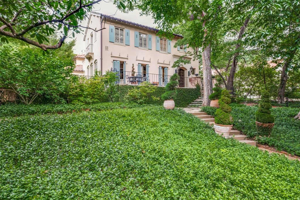 This gorgeous Italian home was built in 1924, and was tastefully updated in 2012. The home is perfectly styled with top of the line finishes, stunning wood and tile work and has original windows that date back to the 20's. This one-of-a-kind historic home boasts a complete guest quarters above the 3 car garage, a chicken coup house, a green house, an elevator and multiple entertaining spaces you can only dream of! There are 4 living rooms, and 2 dining areas on the first floor. The second floor encompasses a master suite featuring his and hers walk in closets, a beautiful en suite bath, and a coffee bar. There is a quaint living room with a cozy fire place in between the primary and secondary bedrooms. This property is situated on an oversized lot in the heart of Turtle Creek with gorgeous landscaping and two different gates to enter and exit. There is truly no home like this in the city of Dallas and is a must see!