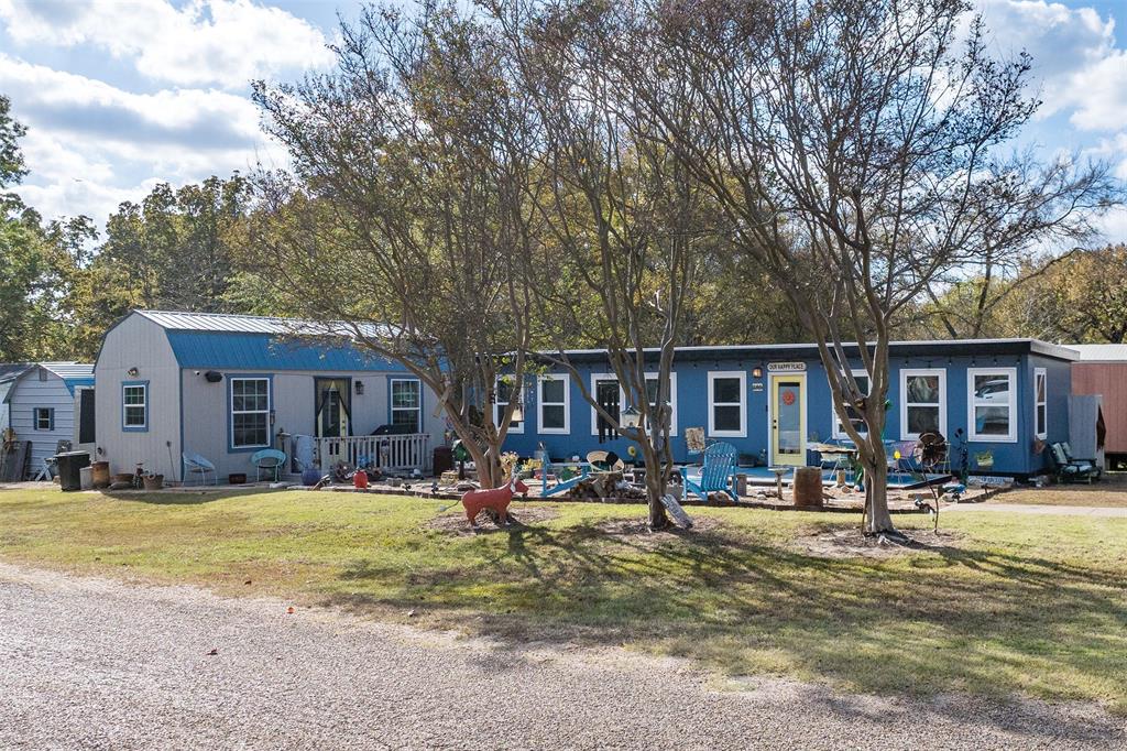 Welcome to your own little piece of paradise near Cedar Creek Lake! This charming and impeccably maintained
property offers comfort, versatility, and peaceful living in a quiet neighborhood just minutes from the lake, shopping,
restaurants, and more. The main home features 640 sq ft of well-designed living space, including 1 bedroom and a full
bath with stackable washer and dryer. The spacious kitchen and living area are filled with natural light thanks to
abundant windows, creating a warm and inviting atmosphere. A beautifully finished 288 sq ft she shed expands your
living possibilities complete with AC and heat, it’s currently used as a second bedroom and office. It also offers a loft
space for extra storage, making it perfect for guests, hobbies, or remote work. The property additionally includes a 240
sq ft storage shed. With two driveways, each equipped with RV hookups, you’ll have ample parking and convenience for
hosting visitors. Whether you’re looking for a weekend getaway, a peaceful full-time home, or an income-producing
opportunity, this property delivers a rare blend of comfort, flexibility, and location. Refrigerator, washer, and dryer will
remain with the home.