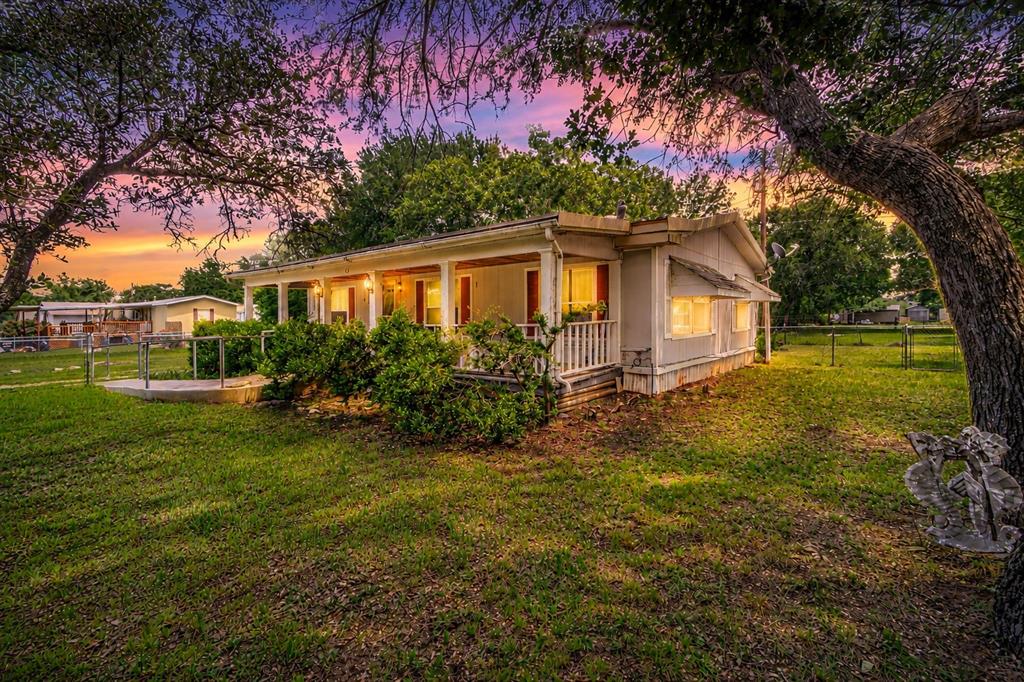 Situated on approximately 2.5 lots, this gated property offers a unique opportunity for investors, flippers, or buyers looking to add value through future improvements. Recent updates include a fully renovated kitchen with new cabinetry and gas stove, updated primary bathroom, and some new flooring throughout. The property also features multiple storage buildings, mature trees, and ample outdoor space with room for a variety of future uses.

This double-wide home offers approximately 1,568 square feet with 2 bedrooms and 2 bathrooms. Improvements have already been started, providing the next owner an opportunity to complete the project to their vision and preferences.

Property is being sold as-is. Certain systems, including plumbing and septic, have not been evaluated by the seller and should be independently inspected by the buyer. Cash purchase only. Buyer and buyer's representative to verify all information, including square footage, condition, utilities, and property details.