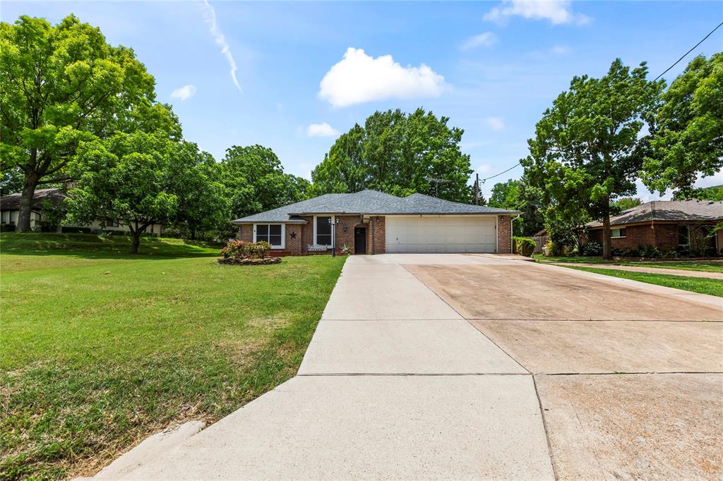 Country feel within City limits! Ready to sit in your backyard and bird watch? Then come on! This HALF ACRE home is within easy access of high I-20 and also Spur 408 to Dallas. Home is located behind the Duncanville Highschool with easy walking distance. This 3 bed and 2 bath home is ready for new ownership. Home contains fresh paint throughout, granite counters, Brazilian Cherry Hardwood flooring and a beautifully shaded backyard, the perfect scenery for relaxing under the pergola, gardening or bbq. Tall truck?,Garage door has been modified to fit a taller vehicle! Garage also includeds a minisplit. Don't miss out on this one, schedule your appointment today!