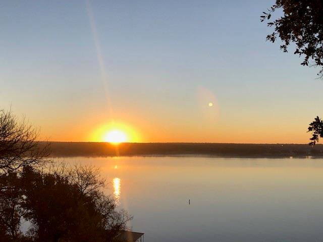 Beautiful tree covered half-acre lake lot ready for you to build your lake home or lake cabin!  This lot is right across the street from the water and is in the gated community of Oak Point at Lake Brownwood. Building requirements are just 960sf heated-cooled space with no masonry requirement so you are free to build a lake cabin OR go as large & elaborate as you want.  Neighborhood has homes as large as 6,000sf!  You can also construct a work shop to store all your lake toys! Abundant Oak Trees, paved road, & close to private boat ramp.  Electricity available via Comanche Electric Coop. Deed restrictions in place to assure quality development. On site sewer septic to be installed by Purchaser. All building plans submitted to Oak Point ACC for approval.  Zephyr Water is in the process of bringing water lines into Oak Point. Currently interior lot owners have water brought in and waterfront home owners pump from the lake.