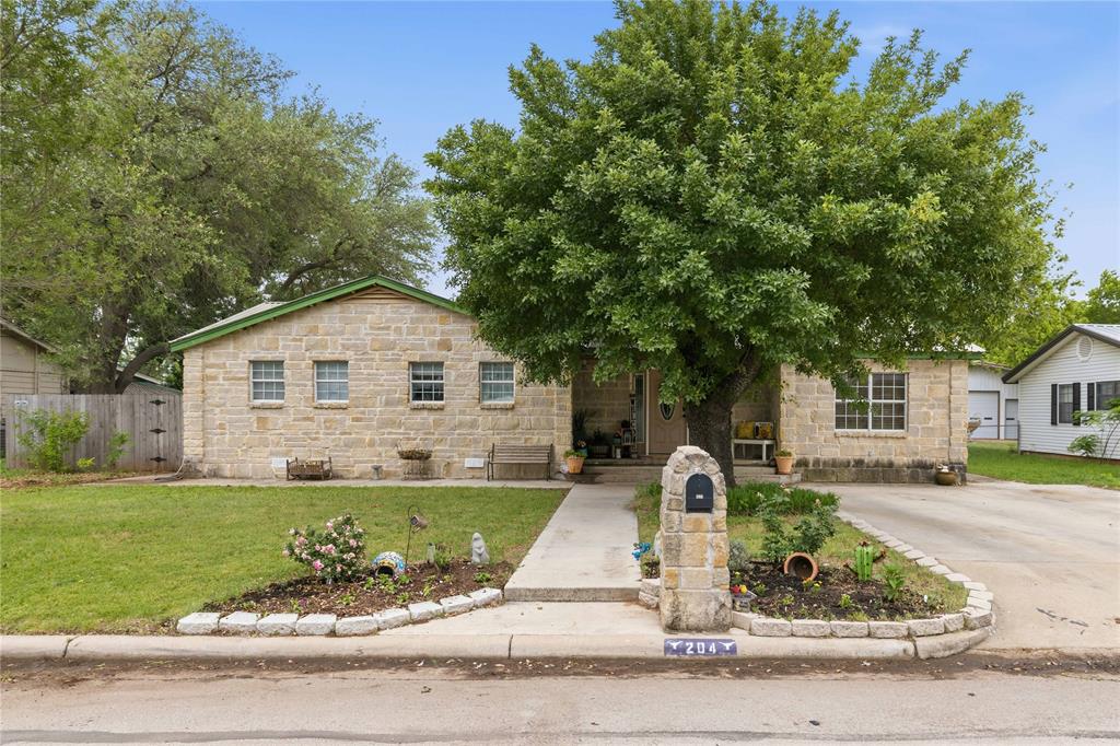 Located at 204 Sunnydale Drive in Early, Texas, this incredibly spacious home was designed to fit it all! Boasting 2,960 square feet, this rare find offers 6 bedrooms and 3.5 bathrooms, providing plenty of room for large families, guests, or flexible spaces like a home office, gym, or hobby rooms. From the moment you arrive, you’ll appreciate the timeless rock exterior, mature shade trees, and inviting curb appeal. Inside, enjoy the updated kitchen and oversized living room serving as the heart of the home—perfect for gathering, entertaining, or simply spreading out and enjoying the space. The layout offers exceptional versatility, with generous bedroom sizes and storage throughout. Step outside to find even more to love, including a backyard storage building for added convenience and an above-ground pool—just in time for those hot Texas summers. Topped with a durable metal roof and located in a great central spot within Early ISD, this property combines size, function, and location in one impressive package. If you’ve been searching for space to grow without sacrificing convenience, this is one you don’t want to miss!