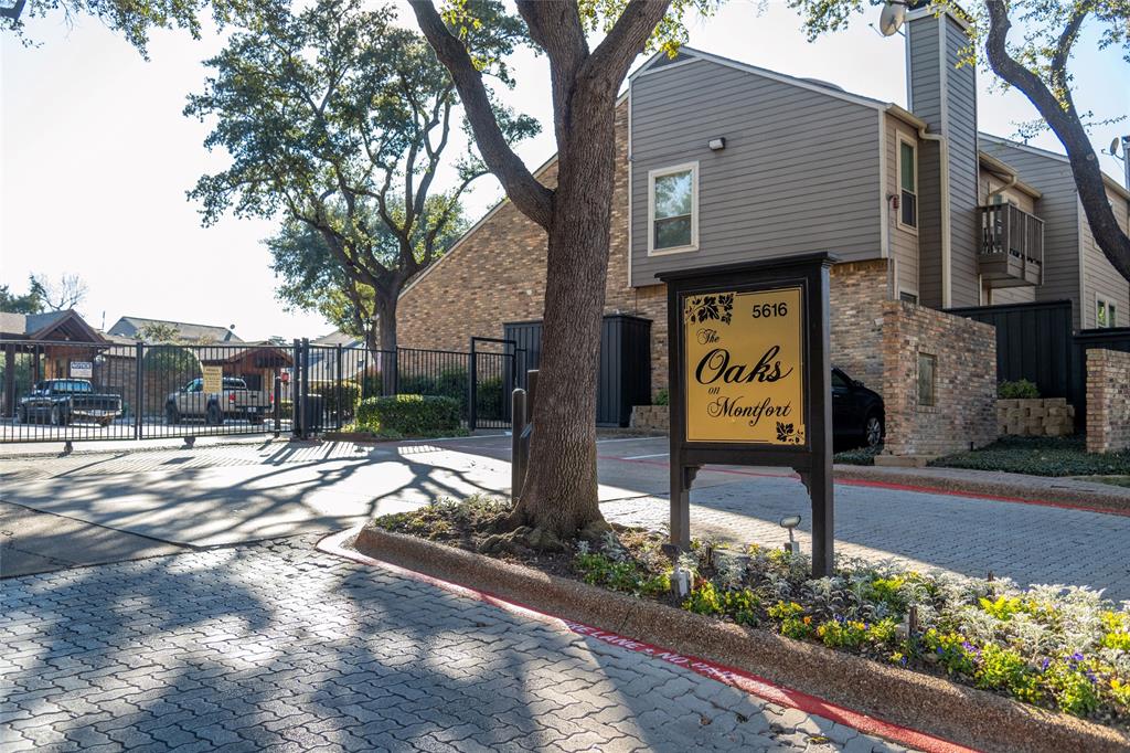 Beautifully treed community just minutes from the Dallas North Tollway and the Galleria. This updated condo features granite countertops in the kitchen and bath, stainless steel appliances, and clean, contemporary finishes throughout. The spacious living area centers around a wood burning fireplace and offers direct access to a private, fenced yard with grassy space, ideal for pets or outdoor relaxation.
The galley kitchen includes white cabinetry, black granite counters, mosaic tile backsplash, and updated appliances. The bathroom has been refreshed with a stone vanity top and full tile surround.
Attached private garage includes built-in shelving for storage and a stackable washer and dryer. Access to the front door is through a gated and secured courtyard entry.
Enjoy two community pools with landscaped grounds, water features, lounge areas, and a covered pavilion perfect for entertaining.