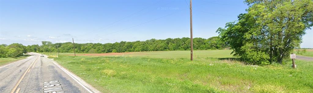Discover the perfect blend of privacy, convenience, and natural beauty on this stunning 11.98-acre tract in highly sought-after Grandview ISD. Nestled just 2 miles from I-35, this property offers easy access to Ft Worth, Dallas and surrounding areas while still delivering the peaceful charm of country living. Chambers Creek runs along the western boundary, creating a picturesque setting and adding unique character to the land. With ample space and flexibility, this property is ideal for building your dream home ranch or weekend retreat with room for a shop or barn. Located outside city limits on a paved county road you can enjoy fewer restrictions and more freedom to create your vision