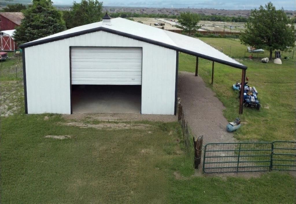 High growth in high demand market east of Dallas.  Incredible location off highway 66 with organic road visibility with high traveled main road.  New development next door including 7-11, Daycare and more close to property.  Floor plan with flexibility for office spaces, retail and more.  Detached Workshop for additional opportunities.  Highly desirable market to grow or establish business. Remarkable Opportunity with Flexible use.

2430 SqFt, 3 BR, 3 BA, Flexible Spaces throughout both inside and out.  
Large Covered Patio.  
40x50 Shop with 2 Large doors and side pedestrian door as well as extension on side.   

Close to I-30.  Near intersection of FM 549 and Hwy 66.  Opportunity to utilize structures on property that includes large brick home as well as shop. Floor plan has flexibility for suite conversions and more with optimal floorplan that includes suites, dual fireplaces and more!  Invest in Fate, east of Dallas, Rockwall County.  Rare opportunity!