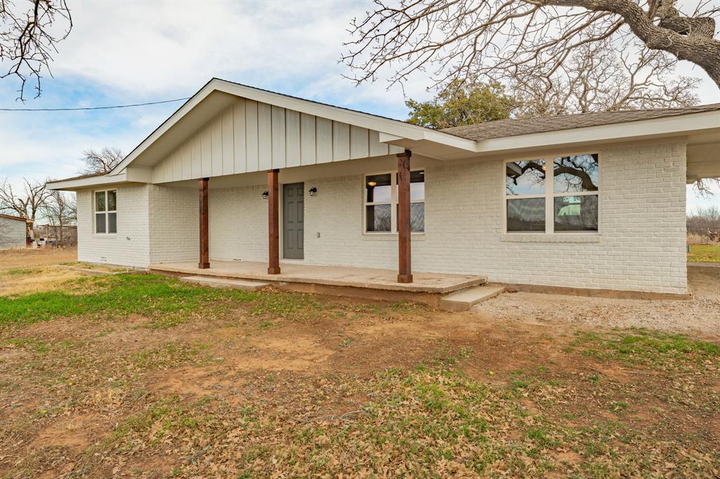 Discover the perfect blend of Country Living and City Convenience in this Like New Three Bedroom, 2 Bath home, conveniently located just outside the city limits on 3041 Old Bunger Road South. Sitting on 1 acre adorned with beautiful mature oaks, this charming property has undergone a complete transformation, stripped down to the framing and remodeled with modern amenities for ultimate comfort. The open-concept layout features a spacious living area with new header beams, complemented by a gourmet kitchen boasting custom-built cabinets from a local artisan, Level 1 Quartz countertops, an undermount twin sink, tile backsplash, a natural gas or electric stove with a vented stove hood, and the luxury of a dedicated pantry. Includes a utility room with hookups. The master closet has a drop-down attic access and additional closets throughout. Both bathrooms shine with fresh updates: the master offers a custom tile shower, vanity, and toilet, while the second includes a new bathtub with tile walls, tub with shower combo, vanity, and toilet—both equipped with vent fans. Energy efficiency is top-notch with spray foam insulation, a new 4-ton natural gas HVAC unit, 10-12 GPM tankless water heater, low-E double-pane argon-filled windows, and a 200-amp electrical service with all-new wiring. Outside, relax on the added 8x14 back porch with gabled roof and concrete patio and park under the 22x20 hip-roof carport, both illuminated by CAN lights. The exterior boasts a new composite roof with Tamco Stormfighter II shingles, Smart fascia, soffit, board-and-batten end walls, and sturdy 8x8 support columns on the front porch with sconce lighting. Additional perks include new Pex plumbing from meter to house, repaired floor joists with LVP laminate flooring; shelving in all closets, and ceiling fans in every room.  Includes a restored 14x22 framed shed with tin roof and Smart board batten siding. This turnkey gem combines rural serenity with easy access to town—don't miss out!