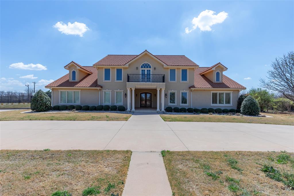 Serene luxury oasis that provides a beautiful setting for a day, a week, an extended stay or a lifetime. You choose how to maximize the useage since there is no HOA.  Over 2 fully landscaped acres of prime Southwest Abilene with views, privacy, luxury. This unique custom home was built with living well in mind - each bedroom (2 primary downstairs and 3 upstairs) has an ensuite bath and large walk in closet.  Several rooms could also be bedrooms since they have closets, and have served as workout, media, meditation and office space.  All 5 bedrooms have no common walls, so occupants are assured of privacy, and can then enter the large common areas where soaring ceilings, marble floors, and decorative light fixtures set the stage for entertaining, events, or simply shared time.  The beautiful kitchen has incredible views and all top end appliances including warming drawer, double dishwasher and SubZero fridge freezer. There is an extra refrigerator and freezer in the large laundry room with a nearby laundry chute from upstairs. The yard is fully landscaped with roses, fruit trees and aromatic shrubs.  A  lighted sport court is currently set for basketball and easily converts to your favorite raquet sports like pickleball.  New hot water heaters, new carpet downstairs and fresh paint throughout the interior of the home so that it is move in ready for you or your guests.  So lightly lived in by the previous owner that it truly feels like a new home, with quality materials not seen in most current new construction such as solid maple custom cabinets and solid wood trim throughout the home. The property has an iron fence perimeter with a security gate and exterior lighting and camera system to add an extra layer of confidence that there is no place like this home - see and make it yours.