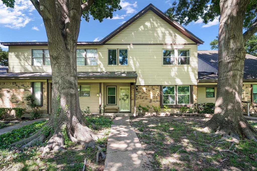 Charming 2-bedroom, 2.5-bath townhome in a prime location overlooking a beautiful park and tranquil stream. This well-maintained home features an updated kitchen, spacious living room with fireplace, separate dining room, and a bright breakfast area. Upstairs you'll find two generously sized bedrooms, each served by a full bath, including the private primary suite. Front door walks out directly to an expansive park with mature trees.

The first floor offers durable luxury vinyl plank flooring, while the upstairs features comfortable carpet throughout. Enjoy outdoor living on the covered flagstone patio, complete with two covered parking spaces and additional storage. Community amenities include a pool and clubhouse. Many recent updates including: HVAC only 6 years old, new floors throughout main areas, and new water heater in 2025. 

Conveniently located near shopping, dining, and major highways, with downtown Dallas just 15 minutes away. A perfect blend of comfort, convenience, and low-maintenance living.