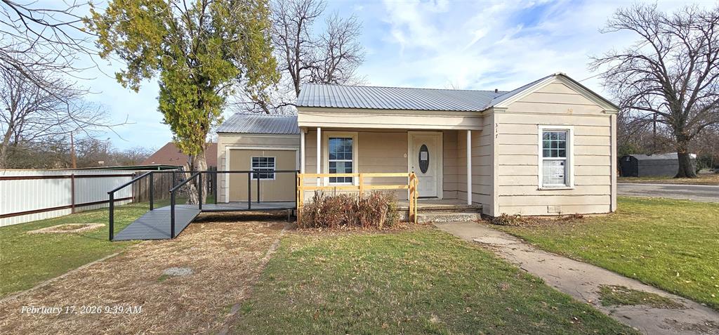 Corner-lot 3-bedroom, 2-bath home offering tons of potential. Last updated prior to 2016. Tile and Hardwood Floors throughout. Enclosed garage provides flexible options—reconvert to a one-car garage, workshop, or possible additional living space.  Great opportunity for investors or any buyers looking to buy in the area. Large yard, Metal roof.  200AMP Service Update Completed March 2026 Meters installed and all utilities available now. *Home may require additional Electrical work to existing wiring in the remaing home to properly work.* Property to be SOLD AS IS. The seller's name is Secretary of Veterans Affairs. Seller pays no closing costs, including title policy, survey ,escrow fee, or transfer fee unless otherwise negotiated. Seller (vendee) Options may be Available! Go to VRMproperties ID #(187787) to find out! If built prior to 1978, Lead-Based Paint may exist. IF house is winterized it may or may not be able to be de-winterized for inspections. Depending on when a offer is recieved utitles may or may not be able to be turned on. Buyer to verify all information and responsible for all due diligence