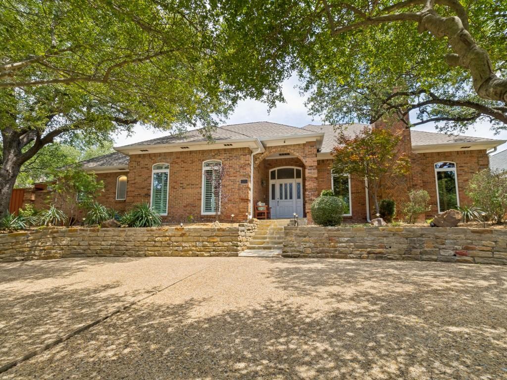 Nestled in the coveted Oak Highlands Estates of Lake Highlands & zoned to acclaimed Moss Haven Elementary, this stunning 4-bed, 3.5-bath residence offers an exceptional blend of space, light & timeless design—perfect for both everyday living & elegant entertaining. Upon entry, the space unfolds to an open floor plan anchored by a grand sunken living room featuring soaring ceilings, rich wood paneling & a striking stone fireplace. Just beyond, the dining area adapts beautifully; suitable for intimate dinners or formal occasions. The spacious eat-in kitchen is ideal for any level of chef featuring SS appliances, granite island & counters, abundant cabinetry, double sink, dual wine refrigerators & wine racks. Thoughtfully updated while preserving its architectural character, the home showcases natural elements including tiger strand bamboo, hickory & Australian cypress wood floors. Custom hickory cabinets & shelves, red oak bath vanities and granite baseboards add to the distinctive craftsmanship while the plantation shutters in the living & primary suite further elevate the home’s cohesive design. The primary suite features tall ceilings, a sitting area, a spa-inspired bath with dual granite vanities, a double granite & glass shower, separate steam unit, His & Hers closets & 2 pairs of Martin Logan ceiling-recessed speakers. The den is tailored for relaxation with a wet bar, icemaker, 2-stage water filter & a nearby half bath. The den also separates the formals & primary suite from 3 additional bedrooms & 2 full baths creating a private wing for family or guests. The tranquil outdoor living area & pool boasts a PebbleTec finish, flagstone deck, slate patio, & a stunning fountain embraced by a private wood fence. Some other features are:dedicated utility room,3-car-garage, circular drive, triple-paned windows, Cat 5-6, ample attic storage, sprinkler system & outdoor storage shed. Buyer and Buyer’s agent to verify all information contained in this listing.