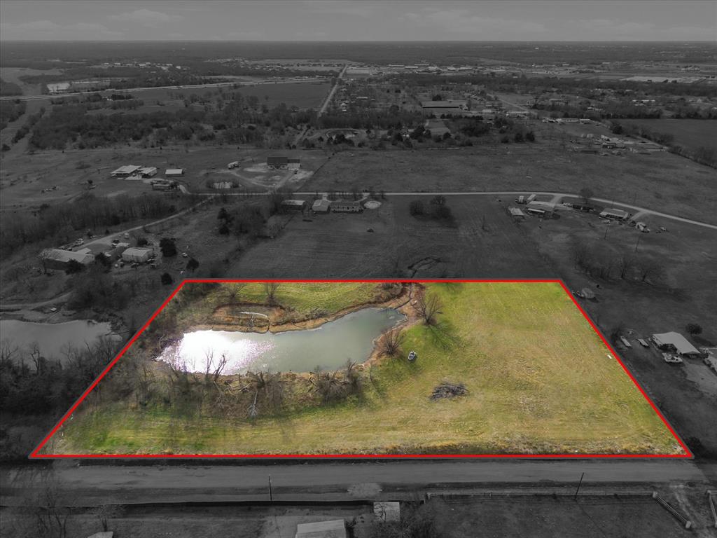 An exceptional opportunity to create a private estate on this 4.7-acre homesite, thoughtfully positioned to capture serene views of a private fishing pond. This property offers a rare blend of tranquility and accessibility, providing a secluded, peaceful setting while remaining conveniently located near town with easy access to I-30. With no restrictions, the land allows for endless possibilities—whether designing a custom luxury residence, an equestrian setup, or a refined country retreat. Existing infrastructure includes a water meter at the road, utility pole on site, streamlining the building process. A distinguished property ideal for those seeking space, privacy, and the freedom to craft a truly personalized homestead. A blank slate and could be YOURS!!