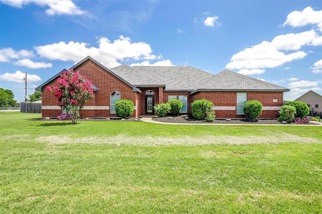 OVER AN ACRE LOT with so much charm!  This home is nestled into a quiet neighborhood with lovely curb appeal & an incredible oversized lot. You’ll find 4 bedrooms, 3 bathrooms, a flex space that could be an extra living space, office or workout room~the possibilities are endless. Walking in the front door you’ll be greeted with new engineered wood floors, a lovely fireplace & an open living room connecting to the kitchen. Through the bright windows, you’ll immediately be drawn to the view of the backyard. This space has so much possibility to create your backyard dreams!  The kitchen boasts of a large island, gorgeous granite countertops and stainless steel appliances with plenty of cabinet space. Check out the additional pantry storage in the hallway! The primary bedroom & bathroom are spacious and offer a retreat from the day. A large walk-in shower and ample closet space. The wide driveway gives extra space for parking when you are entertaining family and friends. You’ll find a neighborhood pond about a ½ mile walk. Located about 25 minutes from Dallas, this gem of an area is growing and has a small town feel near the big city.  Close proximity to restaurants, groceries & shopping, with the quiet retreat of being away from the hustle & bustle of the city. Don’t miss a wonderful opportunity to call this lovely property home!