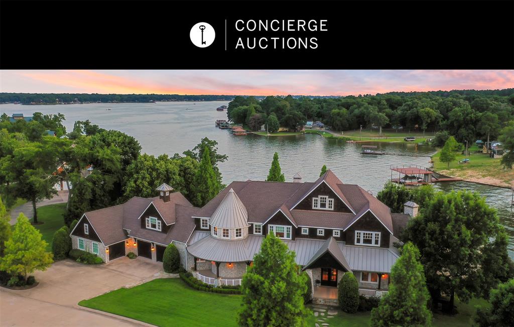 AUCTION BIDDING OPEN: Bidding ends March 5. Previously Listed $4,950,000. Current High Bid $2,400,000. No Reserve. Open House Saturday, Sunday 1-4 p.m. and showings by appt. This beautiful home features a classic stone exterior with cedar shake accents and is surrounded by a lovely, landscaped yard with open water views. The interior is warm and luxurious, with high ceilings and beam work in the main living areas and primary bedroom. Wood and stone flooring alternate throughout the main living and dining areas, bringing a country charm. Curl up with a book and a glass of wine by the stone fireplace or enjoy a quiet breakfast overlooking the water in the cozy kitchen. Host friends on the screened porch that flows onto the deck, grill dinner in the outdoor kitchen, or take a dip in the pool. With waterfront access, you can also take advantage of swimming and watersports. The spacious double-deck dock with composite decking.