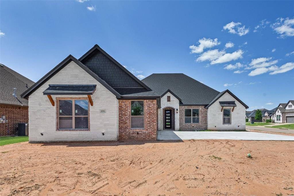 Experience luxury living in this stunning custom new construction home located on the last available lot in the prestigious gated community of Plantation at Harbor Lakes. Situated on a desirable corner lot, this thoughtfully designed 4-bedroom, 2.5-bath home offers exceptional craftsmanship and upscale finishes throughout. Step inside to a grand entryway highlighted by a unique barrel ceiling that sets the tone for the home's elegant design. The open-concept living area features soaring vaulted ceilings, abundant natural light, and seamless flow for everyday living and entertaining. The gourmet kitchen is a showstopper with custom cabinetry, distinctive granite countertops, a large center island, and premium finishes throughout. The spacious primary suite serves as a private retreat, complete with a luxurious ensuite bath featuring a soaking tub, separate shower, dual vanities, and an oversized walk-in closet. For added convenience, the utility room is directly accessible from the primary closet. A dedicated office with French doors provides the perfect work-from-home space and can easily function as a fourth bedroom. Enjoy outdoor living on the covered back porch overlooking a tranquil pond and fountain, creating the perfect setting for morning coffee or evening relaxation. Additional highlights include a 3-car garage, energy-efficient construction, and premium custom details throughout. Conveniently located near Highway 377, Harbor Lakes Golf Club, parks, shopping, dining, and Historic Granbury, this exceptional property offers the perfect blend of luxury, comfort, and convenience.