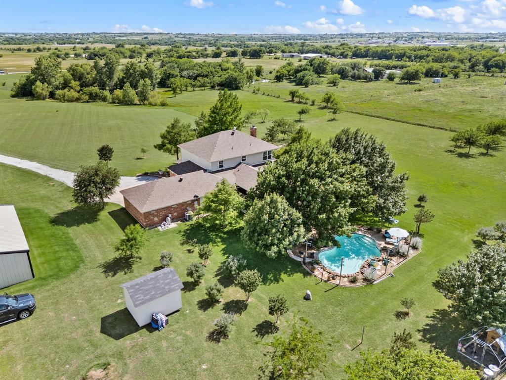 Custom Home on 15.25 AG-Exempt Acres with Pond, Pool, Shop & Prime Location
Enjoy the best of country living with the convenience of town just minutes away. This beautiful custom home offers 4 bedrooms, 2.5 bathrooms, a spacious office, and a game room, all situated on 15.25 AG-exempt acres just a few miles from the Decatur Town Square. With easy access to Highway 380 and Highway 287, commuting, shopping, dining, and everyday conveniences are all within reach.
Beyond the automatic gated entrance, this thoughtfully improved property features fenced acreage ideal for livestock, horses, or a hobby farm. A scenic ½-acre pond creates a peaceful setting, while the built-in pool provides the perfect space for entertaining family and friends or relaxing on warm Texas days.
Additional improvements include a 24' x 40' shop with ample room for equipment, projects, or storage, as well as a chicken coop and separate storage shed. The expansive acreage offers endless opportunities to enjoy the outdoors, pursue agricultural activities, or simply take in the wide-open views and privacy.
Combining a highly desirable location, AG exemption, and exceptional property amenities, this rare offering delivers the perfect balance of rural tranquility and convenient access to everything Decatur has to offer.