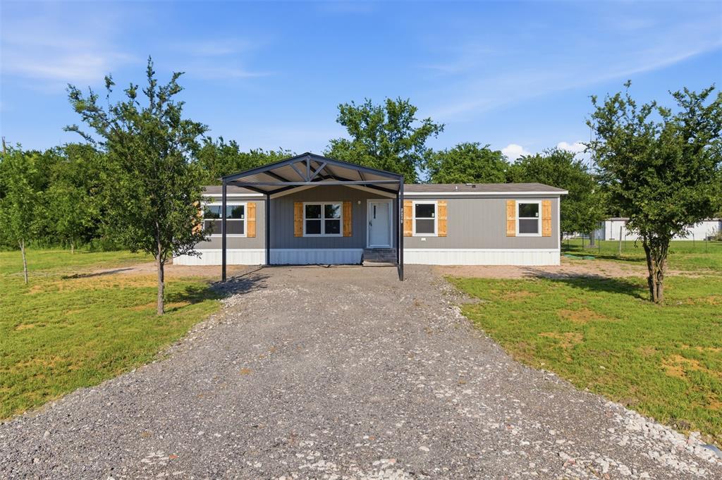 Never-lived-in 2025 mobile home on just under a third of an acre in Farmersville, right behind the Lakehaven community with easy access to Lake Lavon. Spend summers on the water and come home to space, privacy, and a property that's fully yours. 4 bedrooms, 2 full baths, 1,475 SF. Open kitchen with island flows into dining and living area. Split floor plan puts the primary suite on its own side of the home for privacy. Large laundry room. Central heat and air. Covered carport. No HOA. Low taxes. USDA eligible for zero down for qualifying buyers. Not in a flood zone. Easy access to Hwy 78 and US-380. Land included. Listing agent bilingual: English and Spanish. Buyer and buyer's agent to verify all measurements, schools, utilities, taxes, and restrictions.