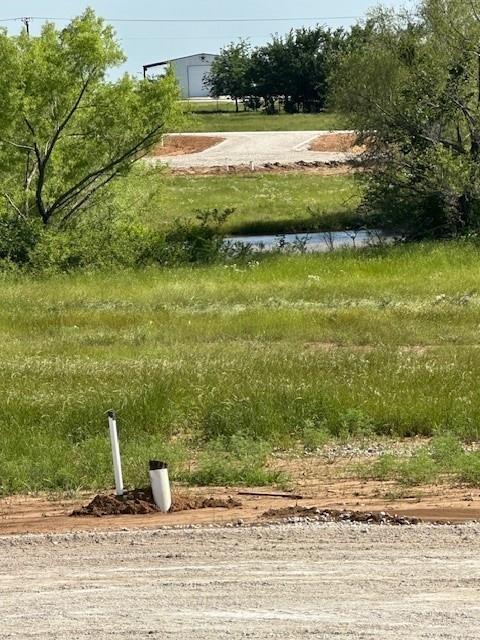 TRULY UNIQUE!!  HIDDEN GEM!  Who would have thought you could build your dream home off of a cul-da-sac with a south-facing back patio  that backs up to a pond ON HALF AN ACRE in Rock Creek Resort!!??  And, at 0.411 acres, this is one of the larger lots in all of Rock Creek!  You will be in the newest addition of the 1300-acre resort that has so many attributes and attractions you'll feel like you're retired - whether you are or not!  The exhaustive list of things to enjoy by virtue of owning this lot include a Jack Nicklaus-designed golf course, clubhouse-pro shop, restaurant, tennis, pickleball and basketball courts, swimming pool, marina, boat slips, equipment rentals, jogging trails and so much more!  Build your dream home now with that infinity-edge pool overlooking the pond or just enjoy all the amenities and stay at the Resort Villas.  There's no required build timeline, just come and enjoy!  It's only an hour north of Frisco or Plano and 1.5 hours from DFW Airport.  Hurry!  This is a unique and rare opportunity!  Note: to view the property you must be accompanied by the listing agent or your trusted Realtor.