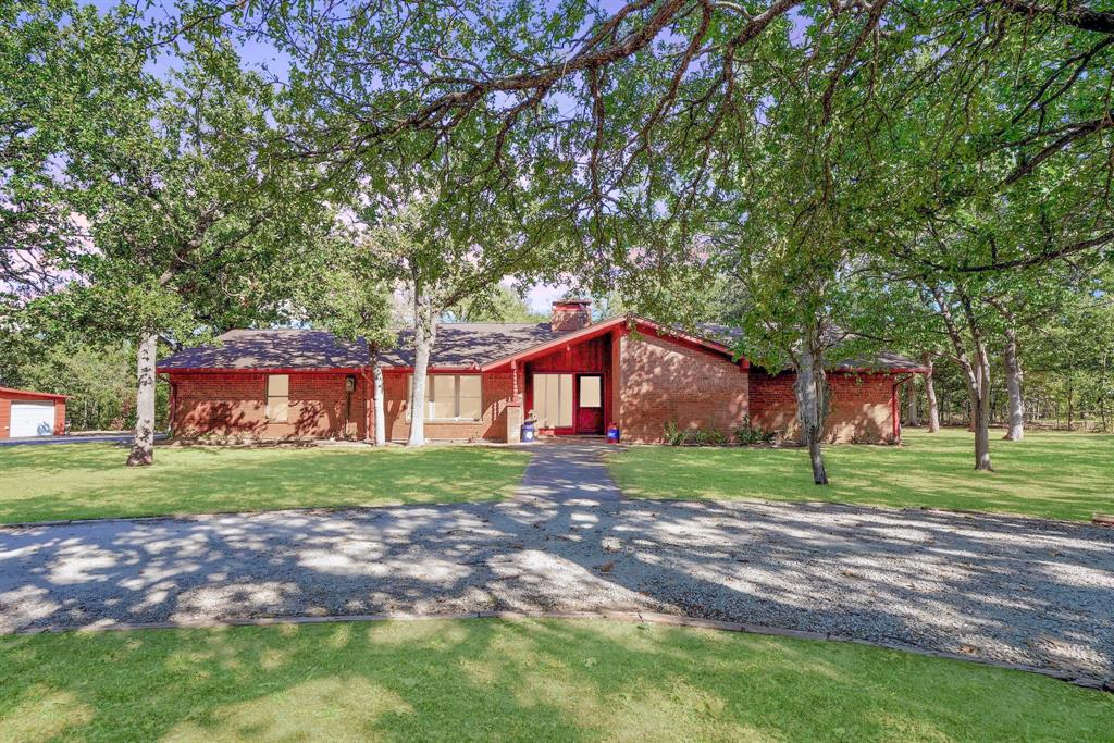 Welcome to this beautiful, private, hilltop estate just outside of the city limits! Located just four miles north of historic downtown Mineral Wells, this property has a rural feel, while still being close to all the fun and necessities! The meticulously maintained main home includes 3 bedrooms, 3 bathrooms, a stunning large living space with vaulted ceilings, updated energy efficient windows and a nice screened in back porch to enjoy the beautiful hillside. The property also boasts a beautifully maintained yard which comes with a sprinkler system run by well water. Whether you need extra parking or would just like to have a shop, this property has it all with a two car garage and an additional shop! That's not all... There is an RV carport, hookup AND check out the furnished one bedroom, one bathroom guest house, complete with its own electric meter. This tiny home has a nice finish out and cozy atmosphere, great for guests or additional living space! NEW ROOF on main house Oct 2023!