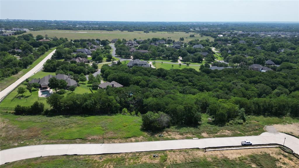 Bring your builder and build your dream home in Sherman's hottest new luxury neighborhood. Located in West Sherman and zoned to TOP rated S&S ISD. One of the few treed, creek lots left, this oversized .34 third acre lot is prepped and ready with all infrastructure in place including gas, electric, water, sewer, streets, and curbs. Heritage Crossing is a quick drive to Sherman's tech corridor and within minutes of Hwy 75, Dean Gilbert Lake, 18 disc golf, parks and athletic complex. The neighborhood boasts beautiful terrain with hills, green spaces, & treed lots. There is no minimum build time with the option to bring your own builder. No MUD! No PID!