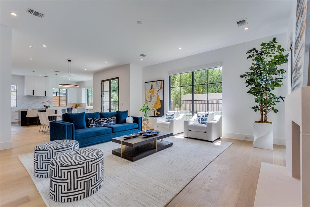 Newly completed in 2023, this light-filled home combines modern details with timeless elegance to create a truly luxurious home. Complete with hardwood floors throughout, this 4280 square foot home resides in Preston Hollow Village and has direct access & walkability to many shops and restaurants. Boasting eleven foot ceilings, the downstairs living area is filled with light from floor-to-ceiling windows equipped with electric blinds throughout. The kitchen features Wolf appliances, ice maker, quartz countertops, ample storage and a Sub-zero refrigerator. Directly off the dining area, you will find a gated side-yard, perfectly sized for outdoor living or pets. Off the kitchen is the three car-garage with electric-plug outlets. The primary bedroom features a luxurious ensuite bath with spacious closet and dual vanities.Upstairs, there are two additional bedrooms each with an ensuite bath and massive living area or media room for the whole family to enjoy.This house is truly spectacular!