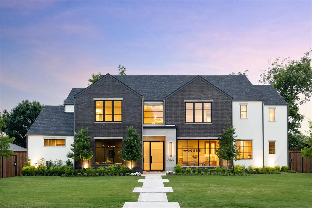 This exceptional new construction by DGM Builders blends striking modern architecture with thoughtful functionality. Spanning more than 6,700 square feet, the home offers 6 bedrooms, 6 full baths, and 2 powder baths with a floor plan designed for both elevated entertaining and everyday living. The main level features both the primary suite and a private guest suite. Designed as a true retreat, the primary offers a spacious sitting area, coffee bar with beverage refrigerator, oversized walk-in wardrobe, and a spa-inspired bath with soaking tub, dual vanities, and refined designer finishes. At the center of the home, the chef’s kitchen is equipped with an oversized island, Sub-Zero and Wolf appliances, and an expansive walk-in pantry. The formal dining room is complemented by a well-appointed butler’s pantry with sink, Sub-Zero beverage refrigerator, and ice maker, creating seamless flow for entertaining. A dedicated study, two powder baths, large utility room with additional storage, playroom, built-in desk area, and mudroom complete the first floor. Upstairs, four additional ensuite bedrooms are accompanied by a spacious game room with pocket doors, a cozy children’s study area, and a secondary laundry room for added convenience. Additional highlights include a three-car garage with tandem bay, dual tankless water heaters, abundant storage, and designer-selected finishes throughout. The outdoor living space is equally impressive with a built-in kitchen, fireplace, phantom screens, and heaters, creating a true year-round extension of the home. Situated in a desirable Dallas neighborhood and built with DGM Builders’ reputation for craftsmanship and integrity, this residence offers exceptional scale, timeless design, and effortless modern luxury.