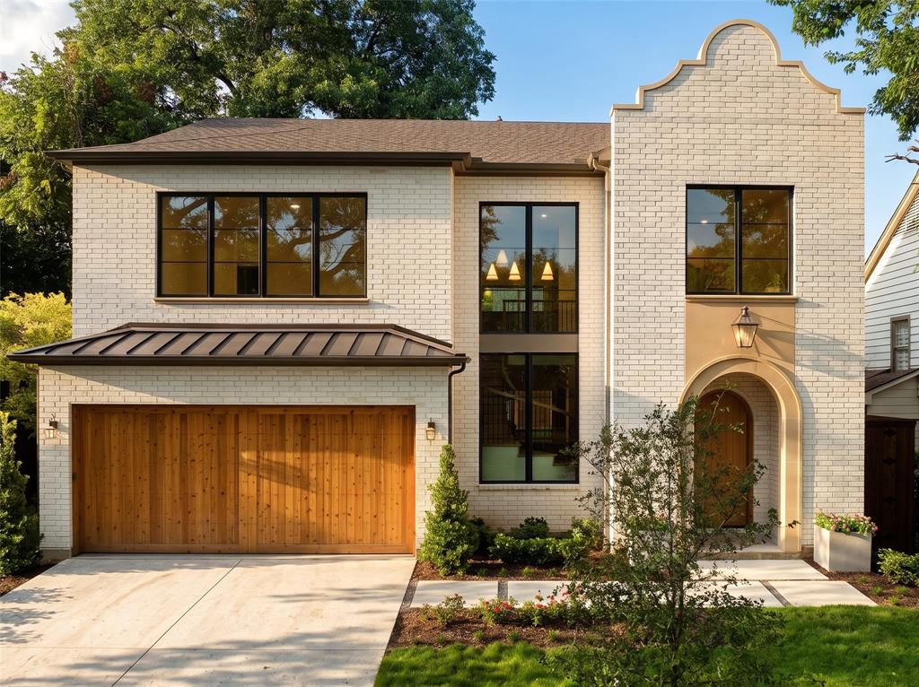 A sophisticated Modern Spanish Revival with warm organic influences. Thoughtfully designed by Ryan Jacobson Design brings to market this new construction in the heart of prestigious Lakewood,  with over 5,100 square feet of refined luxury living. This stunning 5-bedroom custom home seamlessly blends timeless architecture with today's most sought-after finishes and floor plan.
A dramatic arched entry welcomes you into light-filled interiors featuring soaring ceilings, wide-plank hardwood flooring, designer millwork, statement staircase, and an effortless open-concept layout. The spacious living room is anchored by a beautiful fireplace with custom built-ins and opens to the covered patio, creating the perfect indoor-outdoor entertaining space.
The chef's kitchen is the centerpiece of the home, showcasing an oversized waterfall island, premium Wolf® professional appliances, integrated Sub-Zero® refrigeration, custom cabinetry, designer lighting, and an elegant Champagne Bronze hardware package.
The first-floor primary retreat offers exceptional privacy and features a spa-inspired bath with a freestanding soaking tub, oversized glass-enclosed shower, dual vanities, designer gold-toned mirrors, and an expansive walk-in closet.
A private study and first-floor guest suite provide ideal flexibility for work and visitors. Upstairs offers three additional bedrooms, spacious game room, dedicated media room, and abundant storage.
Built with quality in mind, the home features 2x6 exterior wall construction, foam insulation, enhanced attic insulation, premium windows, and carefully curated designer finishes throughout.
Located on one of Lakewood's most desirable streets, just minutes from White Rock Lake, Lakewood Country Club, Lakewood Shopping Center, award-winning schools, dining, and shopping, this home offers the rare opportunity to enjoy modern luxury in one of Dallas' most established neighborhoods.
