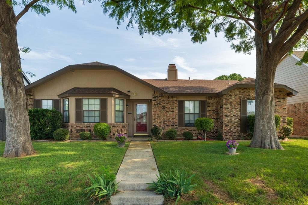 This beautiful home is truly move-in ready, offering thoughtful updates and standout features throughout. The yard is well-manicured and beautifully landscaped, while the backyard is a gardener’s dream with vibrant wildflowers, inviting flowerbeds, and a custom pergola perfect for cooling off and relaxing outdoors. Inside, the home features an open, welcoming layout with beautiful wood floors that make entertaining effortless. The sunroom, fully connected to the HVAC system, adds comfortable year-round living space. The primary suite includes a lovely soaking tub, separate shower, and the walk-in closet doubles as a storm shelter, providing built-in peace of mind. Secondary bedrooms in the main house are thoughtfully split from the primary for added privacy. The converted garage serves as a fully functional mother-in-law suite, now the home’s fourth bedroom, and third bathroom. It includes its own washer and dryer, a small kitchenette, and a private fenced yard — ideal for guests, multi-generational living, or rental income potential. Recent updates since 2024 include a new HVAC system, new water heater, fresh exterior paint, and the custom pergola, ensuring comfort, efficiency, and lasting value. All appliances stay with the home, including washers, dryers, and fridge. This home is priced to sell!!