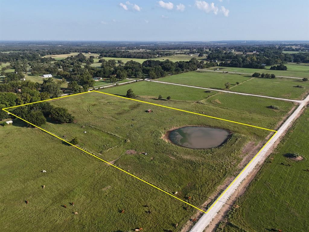 This 8.73-acre tract near Mexia comes with everything you need to get started: a 176-foot pond, gated entry, water meter already installed onsite, power lines ready to tap along CR 463, gas service available through Atmos Energy, and it's been perc tested and approved for conventional or aerobic septic systems. The land's covered in native grazing grasses and has been running cattle for 30 years—current cattle lease is active, so keep gates closed. Build a site-built home (750 sqft minimum), bring a HUD-compliant manufactured home, or park a newer RV (within 5 years, septic required). Property qualifies for agricultural exemption in Limestone County with the 3-acre minimum met. You've got excellent cell coverage across all carriers, Vyve Broadband for internet, and you're close enough to Mexia for convenience but far enough out for peace and quiet.