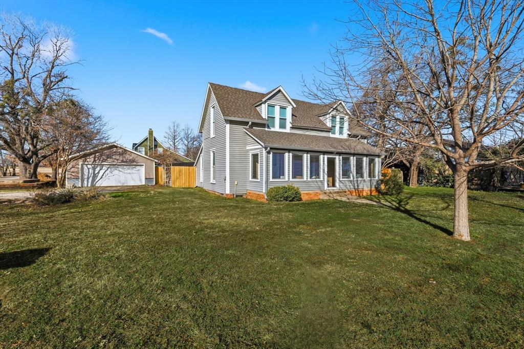 Huge Reduction for a quick sale! Plus, seller will contribute to closing costs or buydown! One of a kind find & location! Step into a piece of Texas history with this beautifully preserved 1911 Craftsman gem, nestled on a desirable one third acre corner lot in quaint old-town Ponder. First home built in Ponder by the lumber yard owner boasting original hardwood floors throughout! This century-old charmer seamlessly blends vintage character with thoughtful modern updates completed just last year—perfect for buyers seeking timeless appeal and move-in-ready convenience. New windows, roof & it has central heat & air besides the window units - use them as desired. Ideally located for families and commuters alike, this home offers walking distance to highly regarded Ponder ISD schools, Marty B’s, the town center, library, food, and parks, plus easy access to nearby Denton, Justin, and major highways for quick travel to the DFW area. Perfect location. Recent improvements include: new roof 2025 for peace of mind, fresh paint on all trim and select rooms, plus elegant wallpapering in the dining room , entry-stairwell, upstairs bathroom, and master bedroom accent wall. Shiplap siding with new drywall ceiling in an upstairs bedroom. All-new light fixtures, added ceiling fans, and ceiling medallions throughout. Oversized 2 car detached garage with lean-to.  Modern touches like TV mounts in the master and living room, blackout shades in bedrooms, curtains on all windows and a replaced drinking water filtration system. The dedicated office can easily be used as a 4th bedroom. City water, city sewer & it has natural gas! This home radiates warmth and character, ready for your personal touch. Don't miss the opportunity to own a slice of Ponder's historic charm in a spectacular, family-friendly location! Also there is a possibility that in the future, this may go commercial! Now is the time to buy!