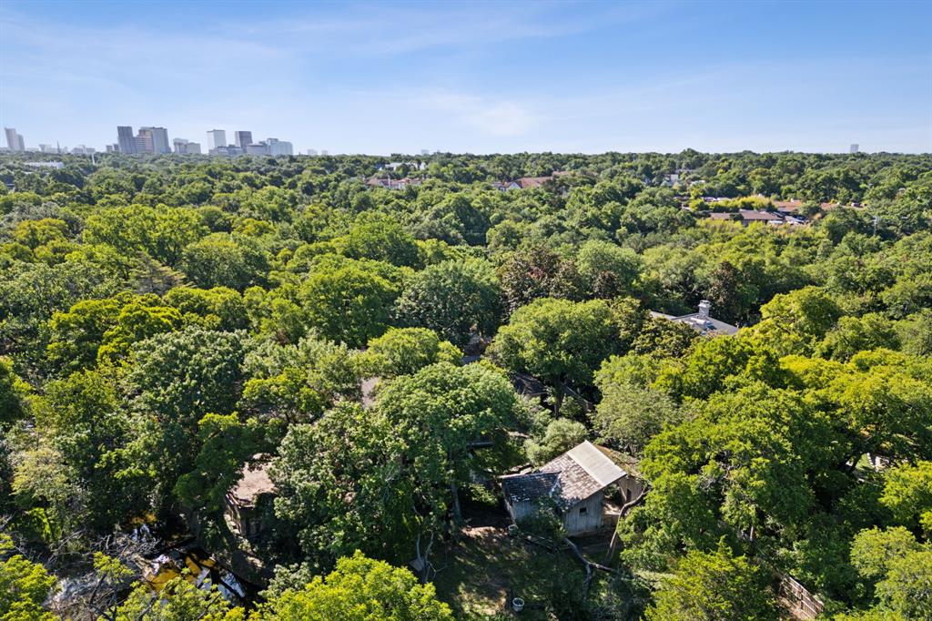 Lush one-acre Preston Hollow lot situated on an idyllic creek offering the perfect location for new construction. Large, level lot with an abundance of mature trees overlooking a serene creek with beautiful water views and tremendous privacy. Insulated cul-de-sac lot in prime location for luxury development. Property sold strictly as is where is.