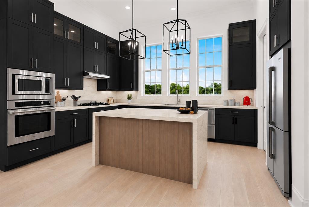 GORGEOUS NEW 4 STORY TOWNHOME WITH BALCONY AND ROOF DECK! SEPTEMBER 2026 COMPLETION. Discover this one-of-a-kind 4-story townhome designed for modern living with a unique open floorplan, soaring 12-foot ceilings, and expansive Anderson windows filling the home with natural light. Featuring 4 bedrooms, 4.5 baths, and a 2-car garage with electric car plug. This home combines elegance with everyday convenience. Step inside to all wood floors and custom wood trim detailing throughout. The gourmet kitchen is a chef’s dream with modern double stacked, furniture grade soft-close cabinetry, upgraded BOSCH appliances, stunning quartz countertops, and a large island perfect for entertaining. Kitchen opens to a  spacious dining and living  room with Marble Fireplace for added ambience! 10 floor sliding glass doors open to a private balcony with unobstructed park and sunset views! Retreat to the spacious primary suite with a spa-inspired bath boasting of marble floors, walk-in shower, large soaking tub, and oversized walk-in closet. The 4th level is an entertainer’s dream featuring a large game room which opens with 10ft sliding glass doors to a private roof deck.  MUST SEE !Located in the heart of Addison, this home offers unmatched convenience—steps from the Addison Athletic Club, just 1 mile to the North Dallas Tollway, minutes from Addison’s Restaurant Row, DFW Airport, Love Field, Galleria Dallas, and Legacy West. Don’t miss this rare opportunity to own a move-in ready townhome in one of DFW’s most desirable urban communities! LOW $145 per month HOA.