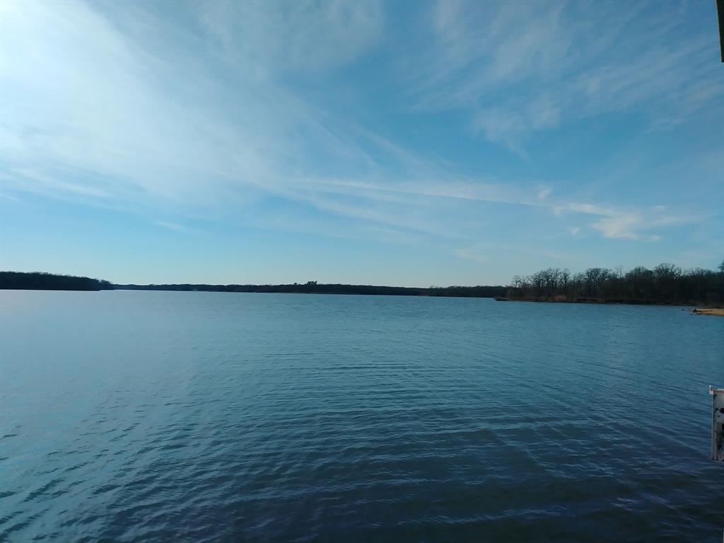 5 acre inner lot with the lake view. Utilities are available. Lot includes boat slip, which is assessed at $500.00 per year. Nautical Shores is off Lake Tawakoni! Nautical Shores offers lakefront living convenient for boating, fishing, swimming & much more!. Lake Tawakoni State Park has several boat ramps & marinas. Convenient to shopping & restaurants in Greenville, Rockwall & Tanger Outlets in Terrell. Less than an hour from North Park Center in Dallas. Choose your own builder. HOA Fees $600 annually, Boat Slip is $500 annually, Sabine River Authority Leaseback is approx. $50 annually,with an approved permit,SRA allows a pier up to 150ft and a boat dock. HOA requires a single story home to be min. 1,400sqft and a two story to be min. of 1,800sqft.