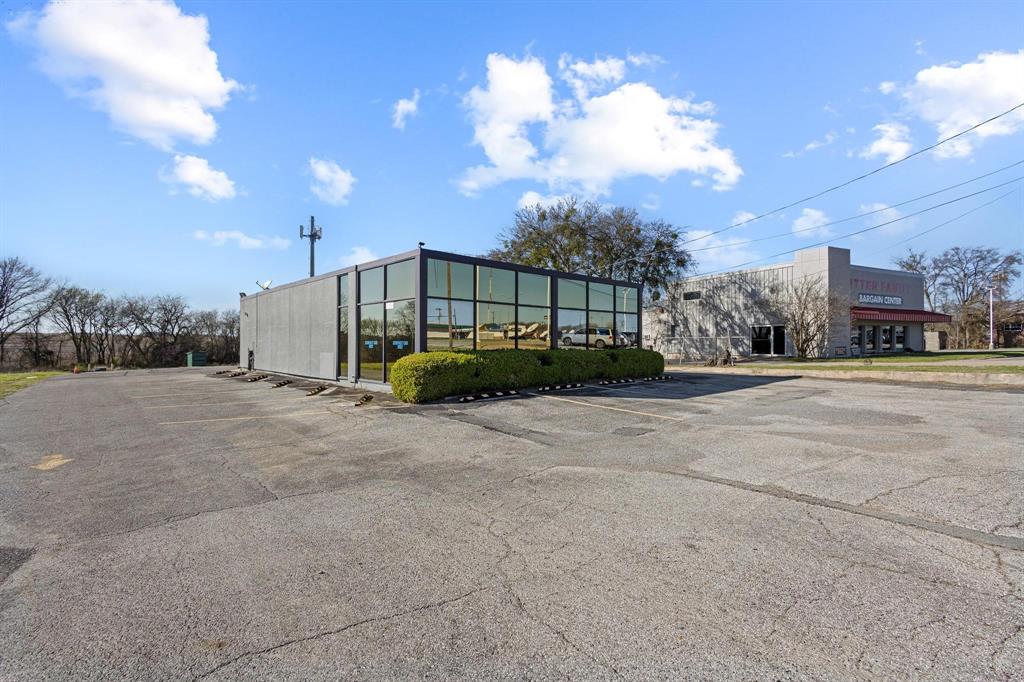 PRICE IMPROVEMENT! PRIME COMMERCIAL PROPERTY! FRONTAGE ON TEXOMA PARKWAY! Sherman, Texas, is experiencing rapid growth driven by major industrial projects such as Texas Instruments ($30B investment, 3,000 jobs) and Global Wafers ($5B investment, 1,500 jobs). The surge in development is creating strong demand for retail, entertainment, health care services, and housing. The City of Sherman is focusing on balancing rapid growth with infrastructure to ensure development is supported by adequate services. Strategic Location – 40 miles north of DFW Metroplex, with direct access to U.S. Highway 75, I-35, and major rail networks. Business-Friendly Climate – No corporate or personal income tax, local tax abatements, and customized incentive packages encourage business. The area offers a skilled labor force supported by Grayson College’s health care and nursing programs and Austin College’s STEM and business programs. Lower Cost of Doing Business – Affordable land, utilities, and workforce compared to Dallas-Fort Worth and other major metros. This office building has been home to a successful medical practice since 1980. The property presents an excellent investment opportunity to purchase now and grow equity as the area continues to expand. With an eye-catching glass facade and sturdy stucco exterior, the building is ideal for a variety of business ventures. The building is turn-key and offers paved parking. Need more space? An additional 1.73 acres adjacent to the property is also available for purchase. Don't miss this opportunity to strategically position your business for success in booming Sherman, TX!