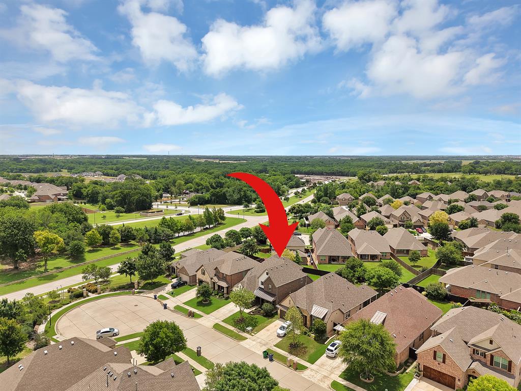 Welcome to this beautifully updated home in the highly sought-after master-planned community of Trinity Falls, where resort-style living meets everyday convenience. Perfectly situated on a quiet cul-de-sac and just a block from one of the community’s clubhouse, pool and soon to be fitness center, this home is truly move-in ready. Step inside to soaring two-story ceilings, rich wood flooring, and an inviting open-concept layout designed for both comfortable living and effortless entertaining. The stunning kitchen serves as the heart of the home, featuring stylish finishes, ample workspace, and seamless flow into the spacious living area anchored by a gorgeous fireplace. A dedicated home office provides the perfect work-from-home space, while the upstairs game room offers additional room to relax, play, or gather with friends and family. Outside, you'll find a huge backyard and covered patio, creating the ideal setting for outdoor entertaining, family fun, or simply enjoying a quiet evening at home. Life in Trinity Falls is unlike any other. This vibrant golf cart community offers an incredible array of amenities, including resort-style pools, clubhouses, fitness centers, lakes, hike & bike trails, playgrounds, splash pads, a dog park, and community events. Families will appreciate the onsite elementary school and award-winning McKinney ISD. Tucked away from the hustle and bustle, yet conveniently located just minutes from shopping, dining, and entertainment, you'll enjoy easy access to Highways 75, 380, and 121, making commuting throughout DFW a breeze. Plus, you'll be near the upcoming $300 million Sunset Amphitheater in McKinney and only about 30 minutes from the new Universal Kids Resort in Frisco. This is more than just a home—it's a lifestyle. Offering the perfect blend of luxury, comfort, convenience, and community, this exceptional home is ready to welcome its next owners. Don't miss your opportunity to experience everything Trinity Falls has to offer.