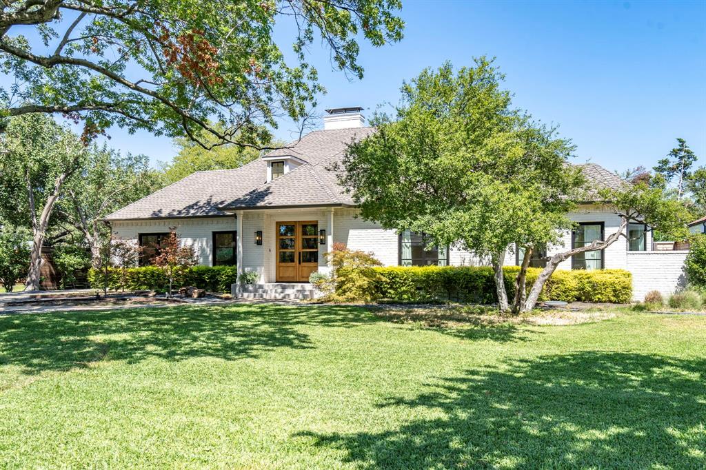 A beautiful remodel in desirable Preston Hollow neighborhood! Gorgeous open floor plan with high end finishes that include white oak hardwood floors, modern Italian kitchen cabinetry from Poliform, indoor-outdoor AV, and custom steel windows and doors just to name a few. The main home is a rare find - single story with 2 large living areas, 4 bedrooms and 3.5 bathrooms. The backyard puts this property over the top with a stunning pool and spa, built in grill, and golf green along with a separate, private patio to the primary suite. Above the 3 car garage you will find a mother in law suite complete with full bath and kitchenette, that can also be used as a game room or office space. This impressive home is ready for you!