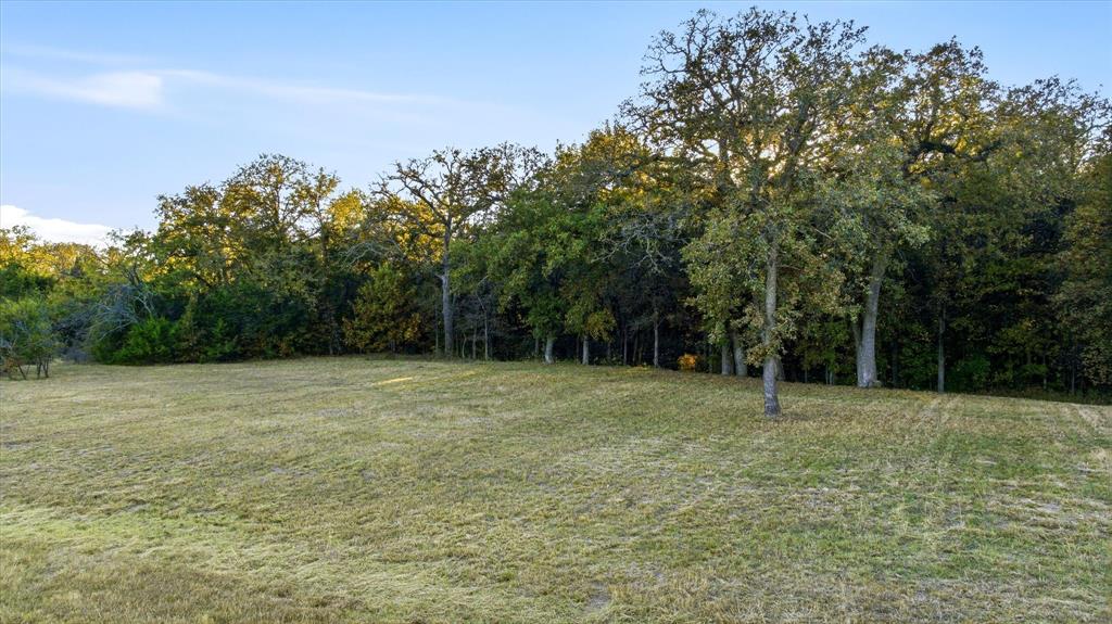 Are you wanting to find that perfect small acreage lot to build a LUXURY home that isn't just a typical cookie cutter floorplan? You don't want the hassle of all of the plans and the wondering if what you want, will actually fit on the lot of your dreams? This is for you! This 3.94 acre expansive lot is located on a quiet cul de sac street in the desirable community of Rolling Creek Ranch. Build Plans- Topo survey is available along with the front elevation and general info of the proposed 5977 sq ft home, with attached and detached garage PLUS a pool. Complete Build plans were done by a renowned local architect and are available for purchase if desired or bring your own ideas...there is SO much room! Rolling Creek Ranch is an exclusive gated community offering that peaceful country feel, stunning views and open spaces while being just minutes from shopping in Granbury and quick access to Hwy 377 to get you to Fort Worth in thirty minutes or less. Enjoy the Historic Granbury Square's local shops and entertainment, golf, numerous dining options and several lake access locations. Rolling Creek Ranch features custom-built homes on 1 acre or more, fishing pond, sport court, and community pavilion all perfect for a family or enjoying retirement. The seller is the owner of the home directly adjacent to the lot and would consider selling the home and the lot as a package deal as well if you just want a home with the additional land for privacy. Dues are just 869 per yr. Seller carry possible.