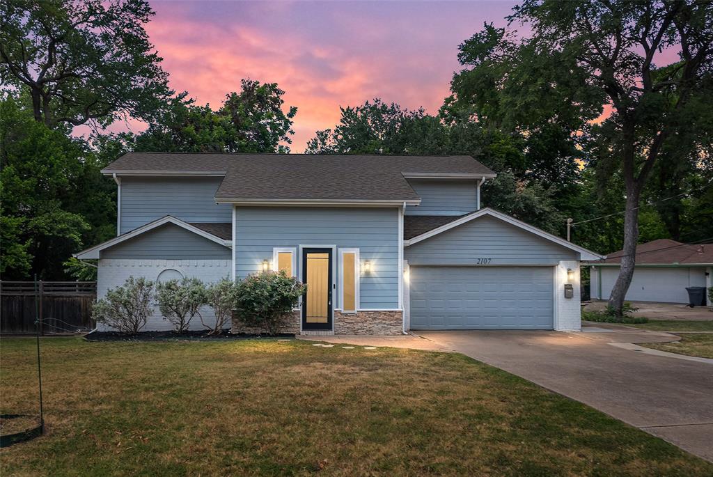 Welcome to 2107 Elmwood Boulevard, a thoughtfully rennovated  3-bedroom, 2.5-bathroom  home that fuses top-tier modern convenience with a serene nature backdrop. Boasting more than $100,000 in thoughtful updates  and high-end improvements since last on the market.  This move-in-ready, 1,935-square-foot residence stands out as a true crown jewel in the highly coveted Elmwood neighborhood.

No detail has been overlooked in this completely elevated home. Notable improvements include 
Brand new, high-efficiency HVAC and complete ductwork replaced in 2024, paired with newly installed double-pane glass windows for exceptional climate control and energy savings. A built-in cabinet in the entry includes two separate wine refrigerators. 
Ready for the future with a dedicated, newly added EV Charger in the garage.The kitchen overlooks a park-like backyard that serves as your private sanctuary. Step outside onto the expansive backyard deck, custom-tailured for weekend barbecues, morning coffee, or entertaining. 
Enjoy a morning stroll to nearby local coffee shops, hit the 2 mile Elmwood trail. A quick drive brings you directly to the renowned Bishop Arts District, famous for its boutique shopping, art galleries, and award-winning dining.

Exceptional Interior & Chef’s Kitchen
The open-concept layout flows effortlessly into a spectacular gourmet kitchen, beautifully redesigned with a massive, oversized central island, granite countertops, and newly updated, stylish kitchen tile work.
The lower-level primary ensuite serves as a true private retreat, now featuring exquisite custom built-in cabinetry for maximizing storage and aesthetic appeal. Upstairs, the flexible bonus layout includes a cleverly integrated, space-saving Murphy Bed—perfect for a seamless transition between a home office, media room, or guest suite. Entertain or just enjoy the outdoors on the extensive deck which runs the length of the house.