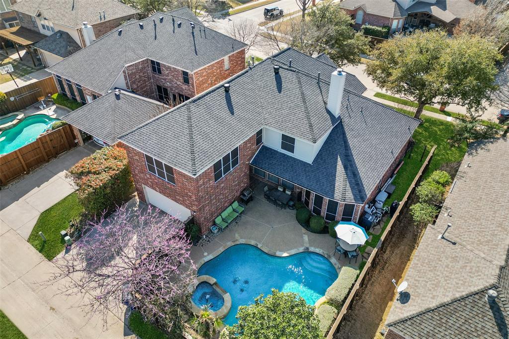 Beautiful home with pool and spa in the highly sought-after Trails of West Frisco. Ideally located just minutes from The Trails of Frisco Golf Club, PGA Frisco, The Star, Universal Kids Resort, and the upcoming Fields West development, you'll enjoy easy access to some of Frisco's best shopping, dining, entertainment, and outdoor recreation. Designed for both everyday living and entertaining, the flexible floorplan offers 4 bedrooms, 3.5 baths, a private study, library, game room, multiple living areas, 2 dining spaces, and dual staircases. The stunningly remodeled kitchen serves as the heart of the home, opening seamlessly to the family room and breakfast area while providing easy access to the backyard retreat. The spacious first-floor primary suite offers privacy and comfort with dual sinks, a separate shower, soaking tub, oversized walk-in closet, and views of the pool and patio area. A dedicated study on the main level provides the perfect space for working from home, reading, or hobbies. Upstairs, you'll find an oversized game room, a guest bedroom with an ensuite bath, 2 additional bedrooms connected by a Jack-and-Jill bath, and an additional office or flex space. Step outside and enjoy your own backyard getaway featuring a sparkling pool, relaxing spa, and plenty of space for outdoor entertaining. Residents of The Trails enjoy exceptional community amenities including 2 pools, tennis and basketball courts, parks, playgrounds, walking trails, and a fishing pond. Conveniently located near H-E-B, Costco, and a wide variety of shopping, dining, and everyday conveniences, with quick access to Legacy West, Grandscape, Stonebriar Centre, and Frisco's growing PGA district. The nearby Fields West development is set to bring even more upscale shopping, restaurants, entertainment, and miles of connected trails to the area. A great combination of location, amenities, and living space in one of Frisco's most established and desirable neighborhoods.